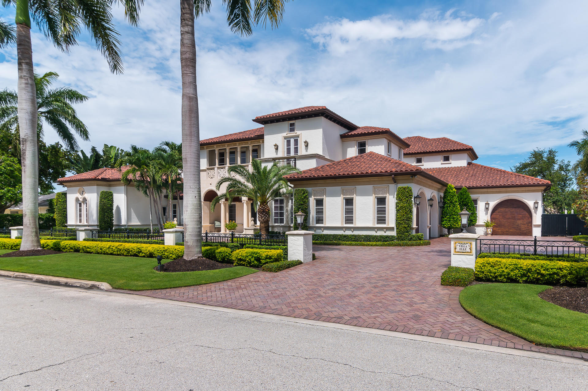 Make your home in the largest residence nestled on a full lot and half, providing 150 feet of pristine golf course frontage in the prestigious Royal Palm Yacht and Country Club.  
Excellence meets elegance in this truly incomparable Mediterranean style home. Over 8,000 square feet of luxe living accommodations including; marble and wood flooring, coffered ceilings, Corinthian Columns, gourmet kitchen, theater, sauna, top of the line appliances, gorgeous outdoor loggia, private office, formal dining room and so much more. Relish in the immense privacy and beauty of the master wing, conveniently located on the ground floor.  Featuring an adjourning sitting room and entrance overlooking the striking pool and spa.  Separate his and hers bathrooms, immense walk in closets, private fireplace and lush wood flooring provide elegance and privacy.  
Venture to the second story to find the remaining bedrooms, each featuring custom appointments, built in closets, and full private bathrooms.  The rear bedroom doubles as a second master with private sun terrace access overlooking the 6th green of the Jack Nicklaus Signature Golf Course.   A lounge area with built in cabinetry and kitchenette offers an area for friends, family, or guests, to relax.  
Move in ready and fully furnished with the highest quality appointments. 
Unrivaled construction quality including; steel reinforced precast concrete, steel infrastructure, whole house generator, impact glass, and concrete second floor.