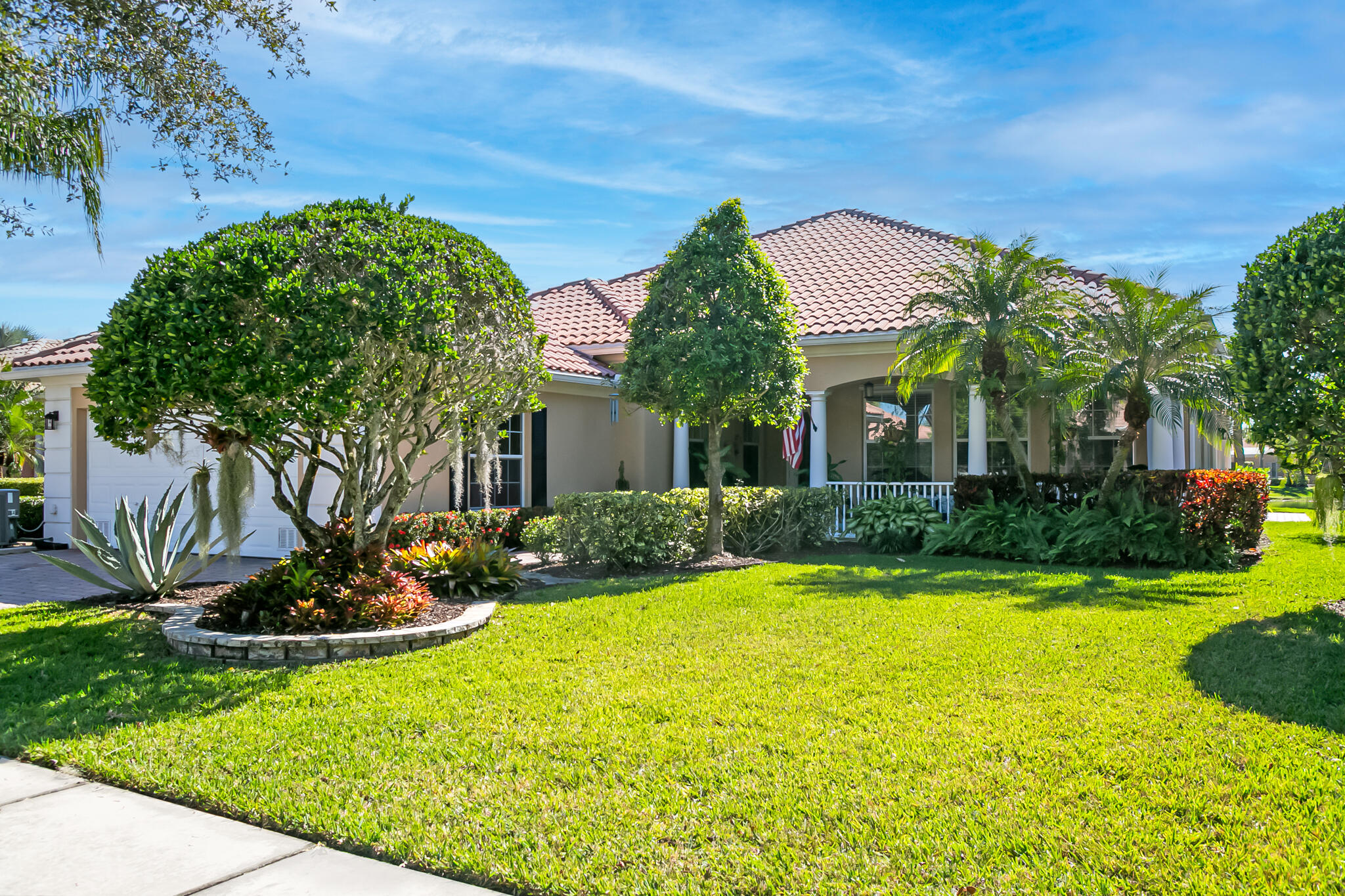 This desirable, quality-built DiVosta Carlyle offers tranquil lake views and a private, screened-in patio—perfect for both relaxation & entertaining. The extended outdoor living space features picture-frame screening, tile flooring, an additional paver patio, & custom landscaping, creating a serene retreat.
Inside, stylish contemporary décor enhances a bright & inviting living room highlighted by a fireplace as a striking focal point, along with an additional great room & a separate office. The home has been thoughtfully updated with tile & laminate flooring throughout, & a beautifully renovated kitchen showcasing quartz countertops, upgraded cabinetry, stainless steel Viking appliances, & a marble tile backsplash.

Additional upgrades include updated lighting fixtures, This all ages community offers a full spectrum of amenities with 2 heated pools, tennis, pickle ball, fitness center, remolded clubhouse, 24 hr manned gate & more. 

This great lifestyle is complemented with a great central location in Tradition and walking distance to downtown Tradition shops, restaurants, parks and activities.