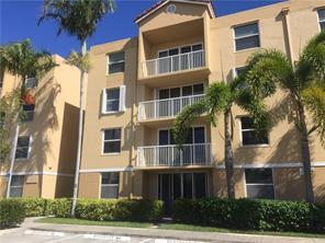 Beautiful and spacious 2-bedroom, 2-bath condo located in a gated community. This third-floor end unit features vaulted ceilings and a private balcony overlooking the pool. Enjoy a split bedroom floor plan, a modern kitchen with granite countertops and stainless steel appliances, diagonal tile flooring in the living areas, and laminate wood flooring in the bedrooms. Full-size washer and dryer inside the unit. Equipped with accordion hurricane shutters, new blinds, freshly painted, and many additional upgrades. Ideally situated between Miami and Fort Lauderdale, just minutes from I-95, I-595, beaches, shopping, and dining. Small pets welcome. Non-smokers only, please.