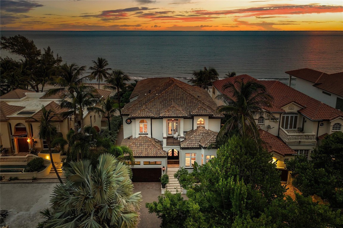 Indulge in the pinnacle of coastal luxury at this direct beachfront estate, blending timeless design with modern sophistication. This residence offers breathtaking ocean views, elegant living spaces, & exquisite craftsmanship. Entertain effortlessly with thoughtfully designed living areas, a chef’s kitchen, & seamless flow to oceanfront terraces with pool & spa. A spectacular 1,000-bottle climate-controlled wine cellar serves as a true showpiece for collectors. The home includes two primary suites, each with spa-inspired baths & private sitting areas, & two additional bedrooms plus a well-appointed office. With refined architectural details & a prime beachfront location perfectly situated between Boca Raton & Delray Beach this estate captures the very best of the South Florida lifestyle. This estate showcases architectural detailing and craftsmanship rarely found today, from custom millwork, a Murano chandelier showpiece, and soaring ceilings to expansive glass walls that frame endless ocean vistas. Additional highlights include spacious guest suites for visitors, Control 4 system, brand new garage door and flooring, summer kitchen and laundry on the main floor. The property also offers a two-car garage, abundant storage, and direct beach access for effortless seaside living.Located in the prestigious town of Highland Beach, this residence provides a serene coastal setting while being just minutes from the fine dining, shopping, and cultural destinations of both Boca Raton and Delray Beach.