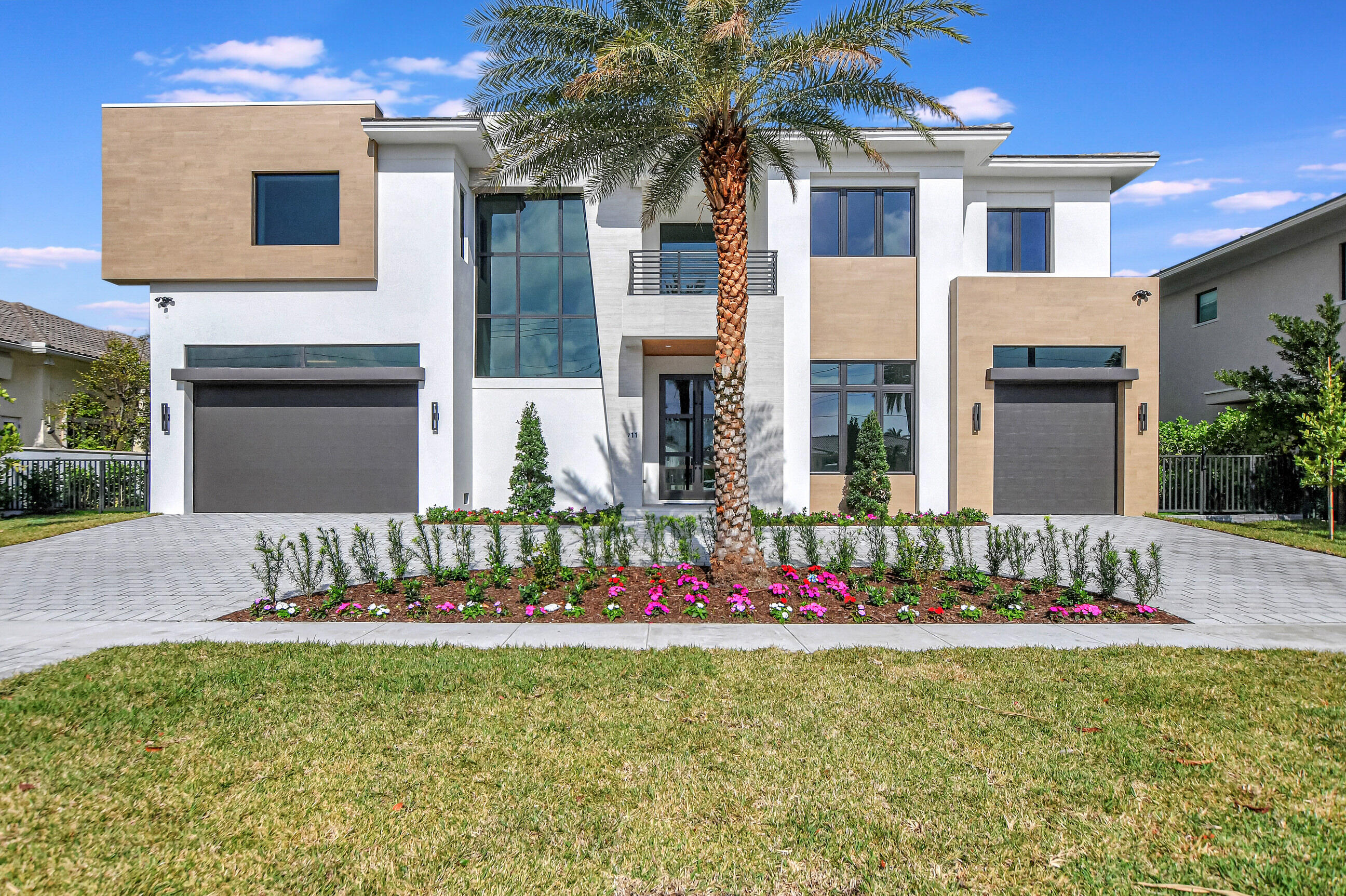 Bring Your Yacht and walk to the beach at this brand new No Fixed Bridge Lake Rogers Isle Deepwater estate. This Luxury New Construction home encompasses unparalleled features, expertly crafted by Elysee Homes, one of Boca Raton's premier custom builders. The residence boasts a resort-style pool deck, a concrete dock perfect for yacht enthusiasts, and full summer kitchen. Enjoy the ultimate comfort with his and her master suites, complemented by a full house generator, elevator, and a natural gas meter. The property's unique appeal extends to its large turn basin, providing convenient boat maneuvering.