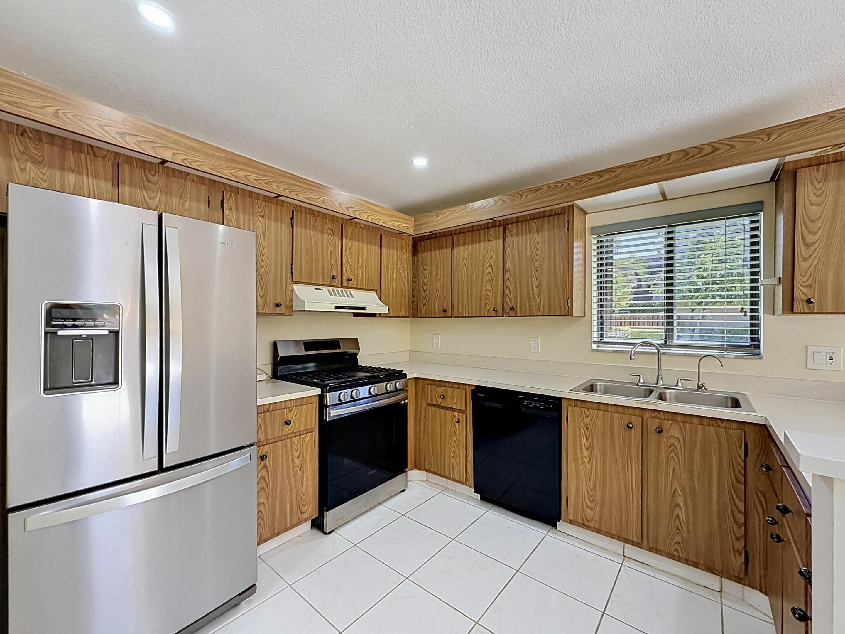 RARE 3BR/2.5BA WITH PREMIUM PRIVACY! CLEAN, WELL-MAINTAINED & MOVE-IN READY!  Low HOA $385/m. Welcome to this spacious townhome (Not condo)  featuring a split floor plan w/ all living spaces downstairs & sleeping quarters upstairs, plus a giant dedicated laundry room/walk-in pantry! Uniquely positioned for maximum seclusion; does not face neighbors & boasts a private courtyard within a lush green space & mature vegetation line. Equipped w/ full accordion shutters for maximum storm protection! Centrally located in WPB with effortless access to I-95, Turnpike, & PBIA Airport. <> <> <> No special assessment or capital contribution fees due from buyer! Seller closing cost assistance is fully negotiable—perfect for a smooth move w/ minimal out of pocket expense. Schedule your tour today! <>