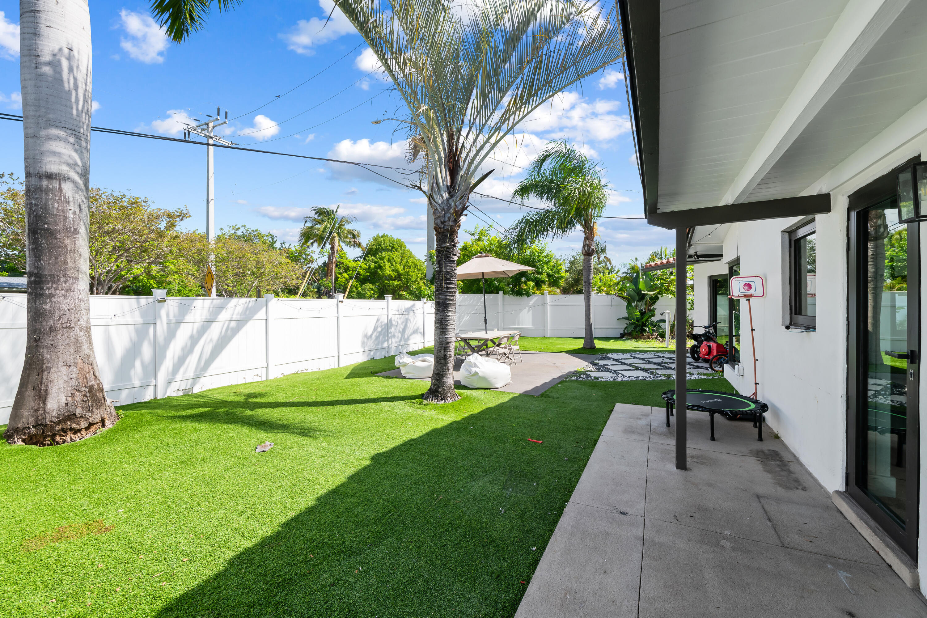 Discover the perfect home in Pompano Beach, just a 5-minute drive to the beach and conveniently located near restaurants, shopping, and entertainment. This charming residence features 3 bedrooms and 2 bathrooms, a separate laundry room, and a beautiful backyard ideal for relaxing or entertaining. The home offers a welcoming living room with a fireplace, a spacious kitchen with high-top seating, a separate dining room, and a covered foyer entry. Each bedroom includes its own closet space, and the home has been freshly painted and is move-in ready. Available furnished or unfurnished.