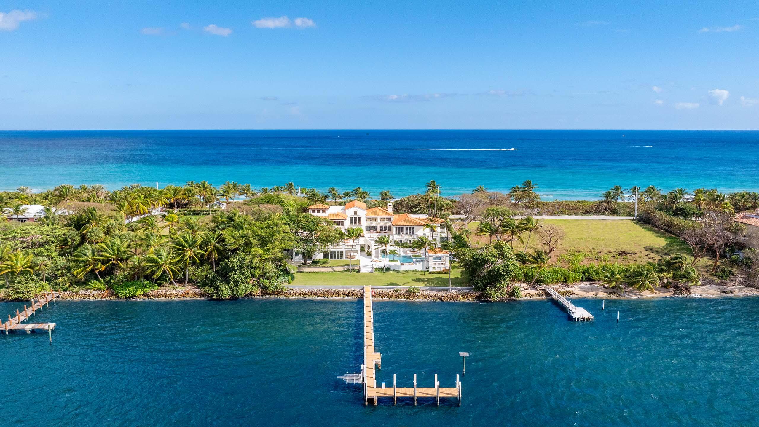 Recently updated, this stunning Ocean-to-Intracoastal Manalapan compound with beach house is situated on almost two acres with 150 feet of direct ocean and Intracoastal Waterway frontage. Boasting over 19,600 total square feet, the residence offers scenic ocean and Intracoastal views throughout and eight total bedrooms including a luxurious primary wing. Many upgrades include new flooring; all new bathrooms; new impact sliders; and new cooler unit in wine room. Multi-level terraces and balconies provide ample room for outdoor living and dining. The manicured grounds include resort-style pool with spa; new landscape; and sprawling lawn that overlooks 150 feet of Intracoastal waterfrontage. Boaters will appreciate the large dock and new seawall plus easy ocean access via nearby inlets. FEATURES:
Located in Manalapan, Florida
Ocean-to-Intracoastal Compound situated on 1.85 acres
150 feet of direct ocean frontage with beach house
150 feet of direct Intracoastal Waterway frontage with large dock and new seawall
8 total bedrooms / 10 full and 1 half baths
11,953 square feet under air / 19,606 total square feet
Decorative drive and porte cochere entryway
Spacious living room with fireplace; volume ceilings; and walls of windows and sliders for water views of the ocean and Intracoastal
Formal Dining room with easy access to kitchen and wine room
Large, open kitchen with two islands; lots of cabinets; breakfast area; and access to the outdoor dining area
Casual living room with bar and walls of windows sliders overlooking the grounds and Intracoastal
Beautiful winding staircases and elevator
Private office and additional sitting areas
First floor luxurious primary wing with sitting area; ocean and Intracoastal views; walk-in closets; and expansive bath with two showers, roman tub, and two water closets.
Multi-level terraces with wide water views and ample space for outdoor dining and living areas
Rooftop observation terrace with indoor wet bar
Resort style heated pool with spa overlooking the Intracoastal Waterway
Tranquil green spaces; large open lawn; and manicured landscape
New seawall and large dock with ocean access via nearby inlets
Private beach house with living area; bedroom and bathroom; seaside deck; and path through dune to the beach
Recent updates include new cooler in wine room; 5 new ac units; new impact sliders throughout; remainder of windows replaced with impact glass; power shutters in place; Control4 system installed for main areas and primary wing (can be expanded); all bathrooms remodeled; primary bath extended to allow for two showers and separate water closets; new flooring in several areas; new seawall on Intracoastal Waterway to allow for a graded green space; new landscaping; new pavers; new skylights; and refinished pool with new water line tile
Ideally located between Palm Beach and Delray Beach; enjoyable drive along A1A for shopping and dining enjoyment.