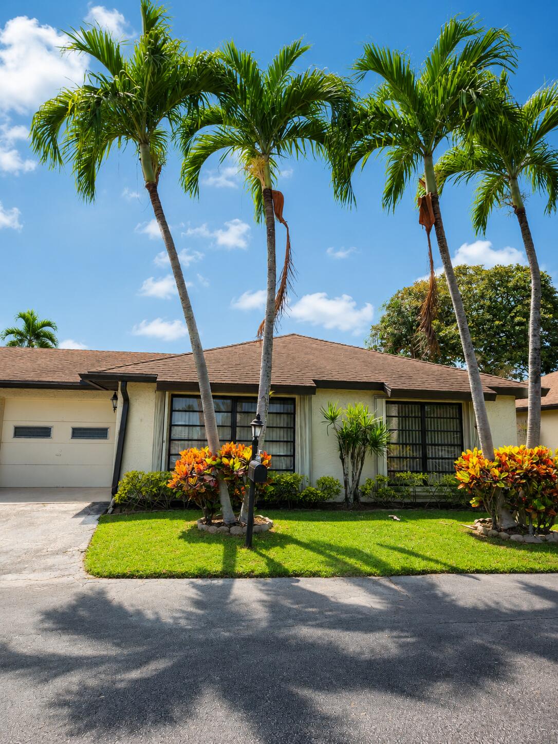 Enjoy peaceful lake views and comfortable South Florida living at 4763 Storkwood Terrace B in Boynton Beach. This 55+ community is well-maintained residence features a brand-new roof, newer flooring, and an updated kitchen with granite countertops and a coordinating granite backsplash.  The elevated Florida room is fully enclosed and under air, creating valuable additional living space that can be enjoyed year-round as a sitting room, home office, dining area, or entertainment space. Large windows showcase the tranquil lake setting and bring natural light into the home.  With important improvements already completed, attractive interior finishes, flexible living space, and relaxing water views, this Boynton Beach property offers an excellent opportunity for buyers seeking comfort, convenie