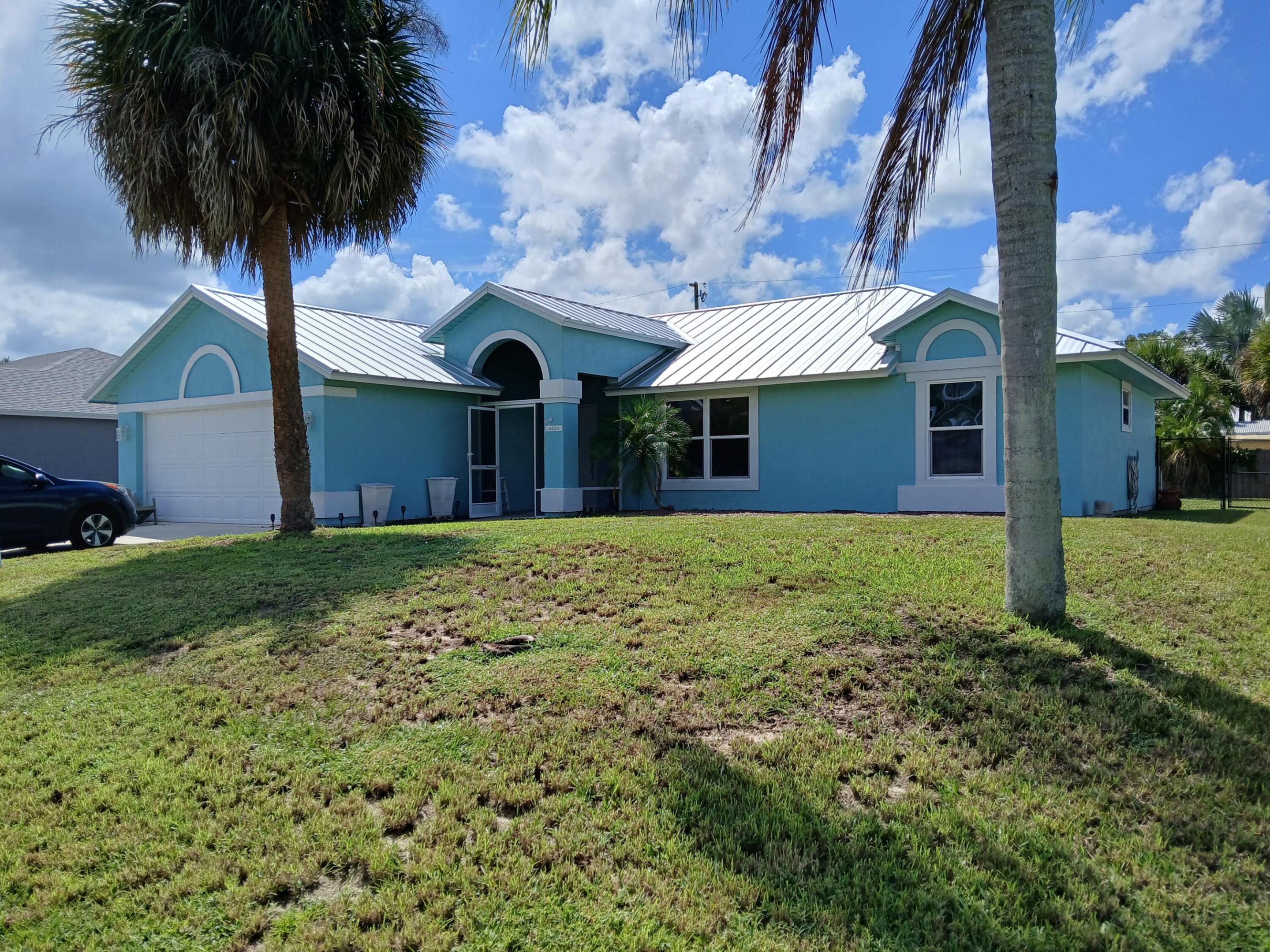 Well Maintained 3 bedroom 2 bath 2 car garage   inground pool fenced back yard. Split bedrooms, both Bathrooms newly updated. Freshly painted interior and exterior. New metal room.. Screened lanai overlooks pool. Tankless water heater