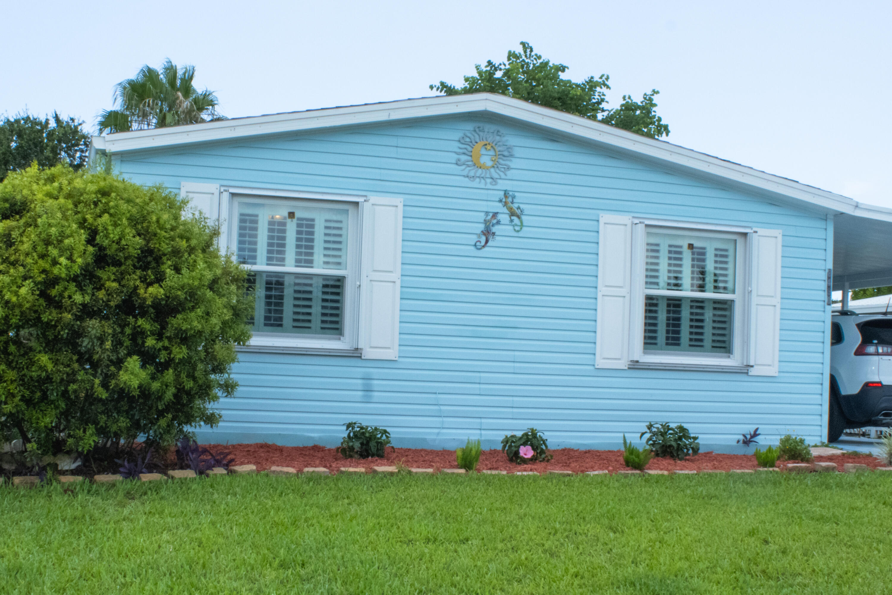 Welcome to this charming three-bedroom, two-bathroom manufactured home located in Savanna Club Plat III in Port St. Lucie, Florida. This single-story residence offers 1,394 square feet of well-designed living space, providing comfortable accommodations for various lifestyle needs. The thoughtful layout maximizes functionality across its three bedrooms and two full bathrooms, making efficient use of the available square footage. This manufactured home presents an accessible and straightforward living opportunity in an established community, offering practical value for those seeking a streamlined property in the Port St. Lucie area. Savanna club offers so much to the community. Two pools, golf course, gym, club house and so much more.  This home is well maintained and has beautiful landscaping.  A sprinkler system that is hooked up to a well helps to keep the yard looking great.  The home has public water that has a filtering system.