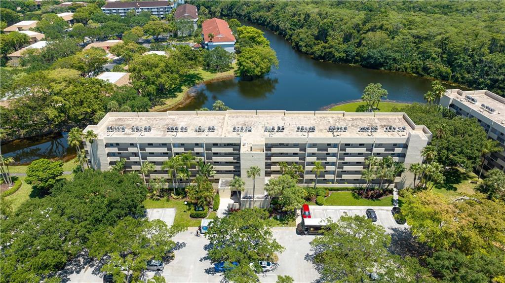 GREAT OPPORTUNITY! Located in the Tradewinds section of The Township. This 2 bedroom / 2 full bathroom condo unit is located on the 2nd floor with expansive lake views! This property is in original condition & does need everything, flooring, kitchen, bathrooms & painting. Currently there is a pending sale in this building priced at $265,000 so there is plenty of equity to make this unit your own. As an additional bonus this property has a great parking spot right next to the entrance. Note: in the 2nd bedroom the owner added a closet but can be removed to create more space. The Township is a well-maintained community offering plenty of amenities such as an aquatic center, tennis courts, athletic club, & a ballroom that is available for resident party rentals. Come make this your new home!