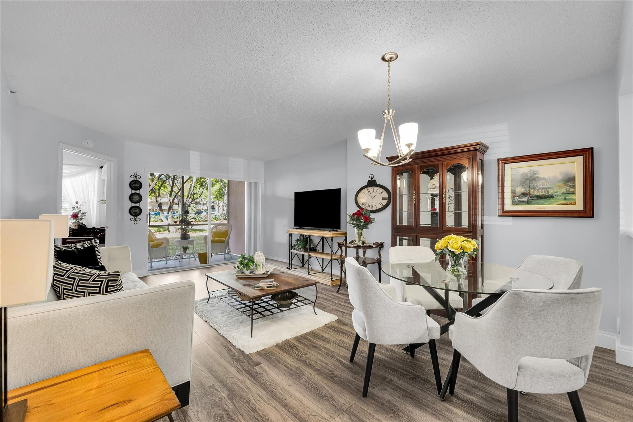 WOW! GREAT PRICE FOR THIS COMPLETELY UPDATED 1ST FLOOR UNIT. THIS IS A MUST SEE! Beautiful wide-plank quality wood laminate thru out, remodeled kitchen with contemporary counters, backsplash, newer stainless appliances. Beautifully updated baths, include a unique Jack&Jill layout with 1/2 guest bath access to tub room. Top-of-the-line front-load washer/dryer leaves nothing for you to do. Your convenient assigned parking spot is just steps from your front door. Hot water heater 2022. Come experience the sought-after Kings Point lifestyle with endless amenities including social clubs, theater, shuttle, pickleball, indoor & outdoor pools, fitness center and more. All conveniently located near major highways, shopping and restaurants! Water, cable & internet included. Ok to lease after 1 year!