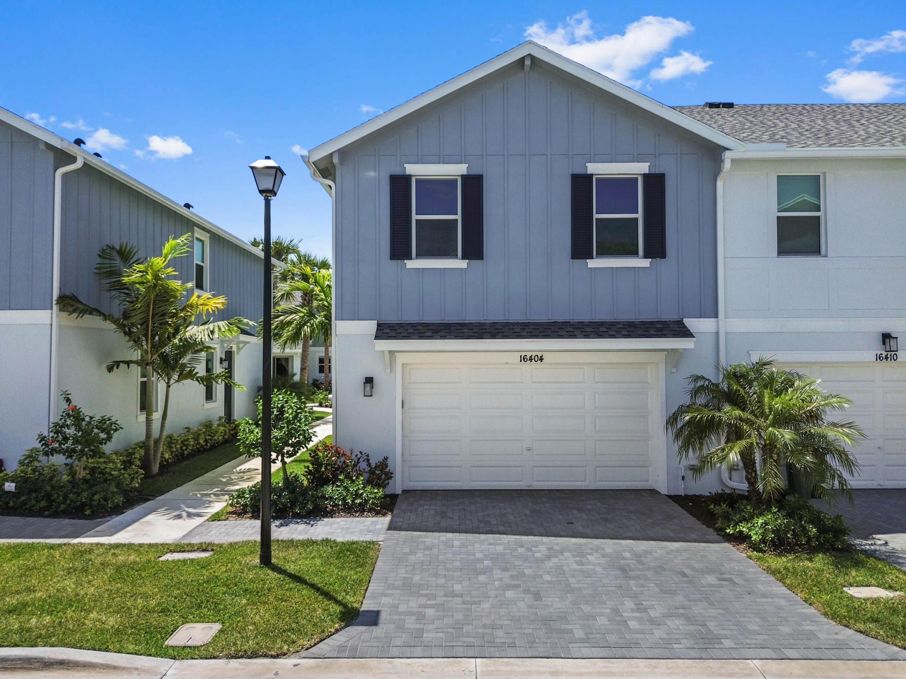 Welcome to a 4 bedrooms and 2.5 bathrooms townhouse, where refined comfort meets the peaceful charm of Loxahatchee living. From the moment you enter, you're greeted by a bright, open-concept design that effortlessly blends spaciousness with warmth. Expansive living areas are filled with natural light, creating an inviting atmosphere perfect for both relaxed everyday living and entertaining on any scale. The interior showcases a thoughtfully designed layout with generously sized bedrooms and well-appointed living spaces that feel both functional and elevated. The kitchen serves as the heart of the home, offering ample cabinetry, workspace, and a seamless connection to the main living and dining areas—ideal for hosting or simply enjoying time at home. Large windows and sliding glass doors enhance the flow of the home, bringing in natural light while offering tranquil views of the surrounding property.  Step outside to experience your own private retreat, where outdoor living takes center stage. Situated in a desirable Loxahatchee location, this home offers the perfect balance of privacy and convenience, with easy access to shopping, dining, and everyday essentials while maintaining a serene, tucked-away feel.