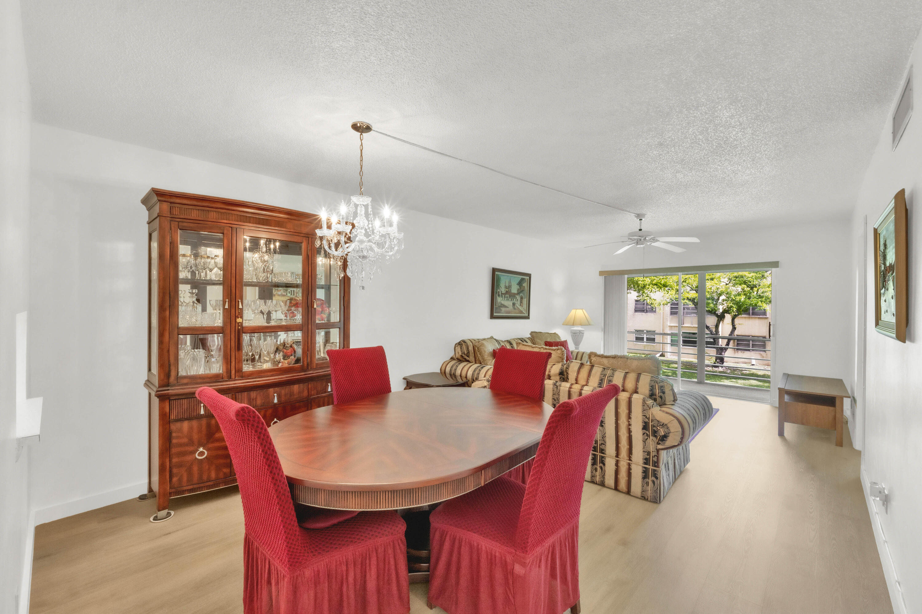 Impeccably maintained 2-bedroom, 2-bath second-floor condo in the desirable gated, pet-friendly 55+ community of Carriage Hills. This bright, freshly painted home features a spacious split-bedroom floor plan, screened lanai, new woodgrain luxury vinyl flooring throughout, and tile in the kitchen and baths. Newer HVAC (2021), roof (2021) and water heater (2024) provide added peace of mind. Convenient card-operated laundry is nearby. Enjoy beautifully updated amenities including an active clubhouse, resort-style pool (renovation nearly complete - 2 other satellite pools are open), fitness center, sauna, steam room, tennis, basketball, pickleball, and scenic walking paths. Ideally located near shopping, dining, and major roadways.