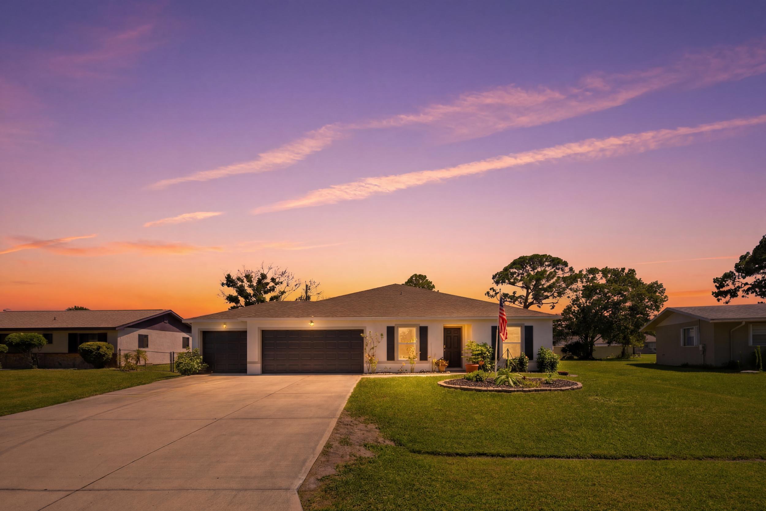 This 4-year-young 4 BR 2BA 3 Car Garage split floor plan is the perfect blend of style, comfort and functionality. Situated on a fully fenced homesite. Driveway provides ample space for recreational vehicles. Formal dining offers versatility as a home office or flex space to fit your lifestyle. The open concept - chef's kissed kitchen with island seamlessly connects with family room - creating the perfect setting for casual everyday living and effortless entertaining. The primary ensuite provides ample privacy and boasts a spacious walk-in closet. Sliding doors lead to an incredible outdoor oasis - an expansive covered screen porch spanning more than 550 sq ft, providing year-round enjoyment and the ultimate space for gatherings. The backyard is ready for fun with a brand-new above-ground  pool (½  inground - ½ above ground), dedicated dog run and plenty of room for play or garden. Located in the heart of town - close to shopping, beach, hospitals, major routes of transportation, A rated schools, parks and major routes of transportation. This is a must see!