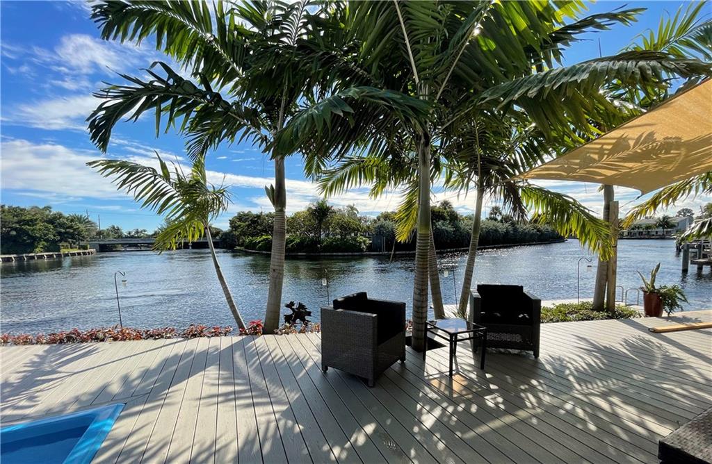 ONE OF A KIND POINT LOT 100' WIDE WATER VIEWS EAST WILTON MANORS--MID-CENTURY MEETS CONTEMPORARY STYLING IN THIS OCEAN ACCESS GEM.  OVER $150,000 IN RECENT UPGRADES. HUGE CHEF'S KITCHEN W/TONS OF CABINETRY, WINE COOLER, EAT-IN KITCHEN ISLAND, QUARTZ COUNTERS, RESTORED TERRAZZO FLOORS, OVERSIZED MASTER SUITE W/OFFICE AREA. TONS OF UPGRADES, IMPACT WINDOWS, NEW DECKING, POOL & AWNINGS.  2 FIXED BRIDGES.  BRIDGE CLEARANCE: 8' at Medium Tide, 10' around Low Tide. NOT TO BE COMPARED TO AN INSIDE LOT....THIS IS A POINT LOT ON MIDDLE RIVER WATERWAY AT THE END OF A QUIET CUL DE SAC (NOT AN INSIDE CANAL)!!VIEWS FROM EVERY ROOM EXTENDING OVER 1000FT DOWN THE RIVER!! ONCE IN A LIFETIME OPPORTUNITY AS ONLY A FEW LOTS LIKE THIS IN WILTON MANORS!