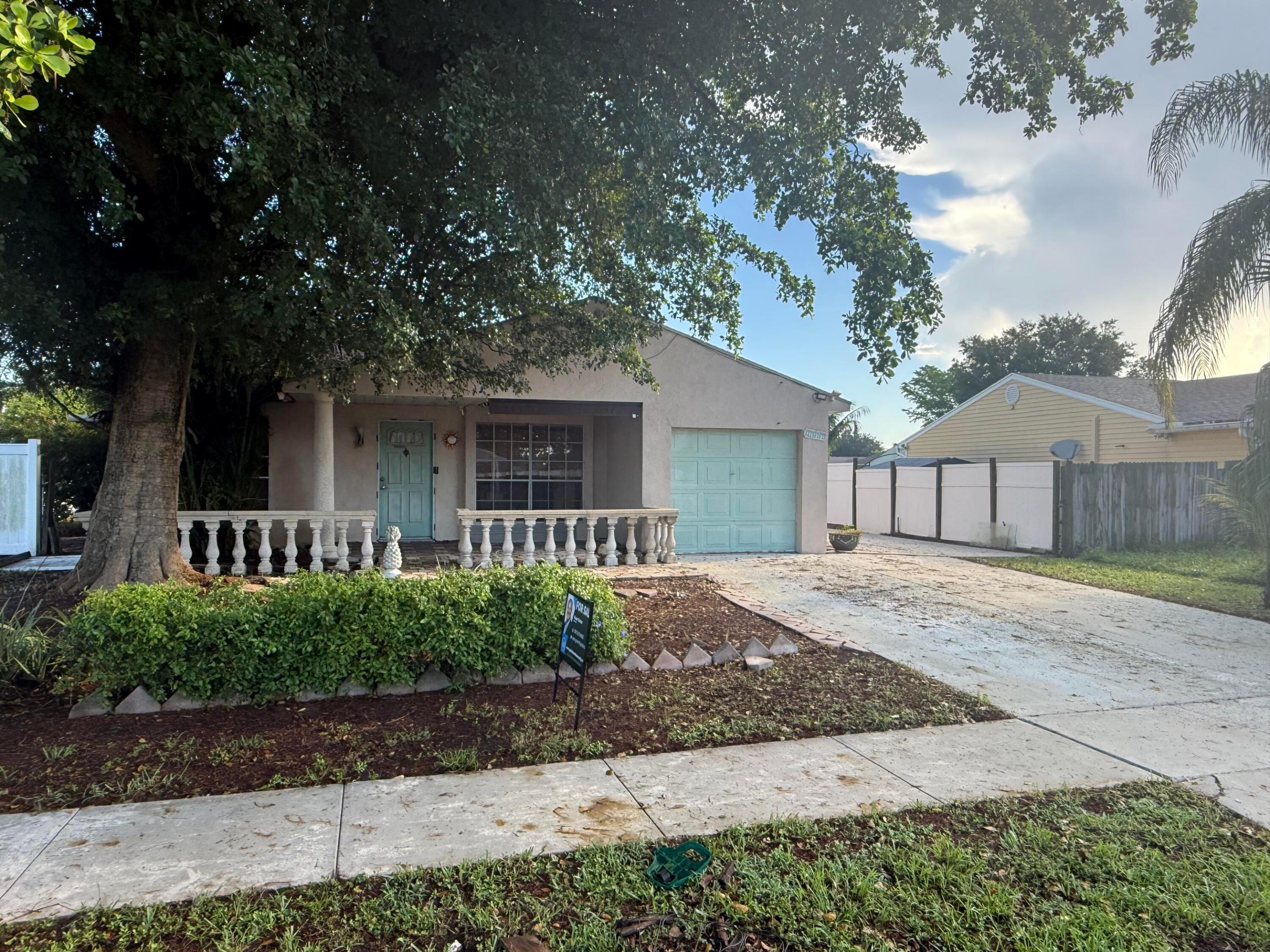 Calling all investors!  This 2-bedroom, 1.5 Bath, Flex room and single car garage home in Royal Palm Beach is ready for your next value-add project.  NO HOA restrictions gives full flexibility for renovation, rental, or resale.