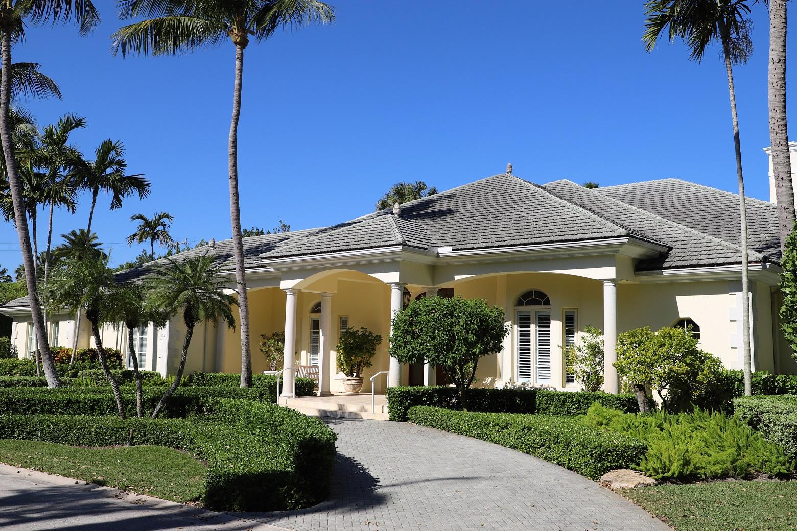 Stunning single story Bermuda with 5 bedrooms and 5.5 baths. After entering through an expansive foyer you will be captivated by the scale of the living spaces with high ceilings providing tremendous volume and a gracious flow throughout.  Over 8,100 sq ft of space includes a new kitchen, den, oversized loggia with summer kitchen, new wood floors, impact glass, 3 car garage and full house generator.  A serene and peaceful setting ideally located on a 27,000+ sq ft lot in Palm Beach's exclusive Phipps Estates.