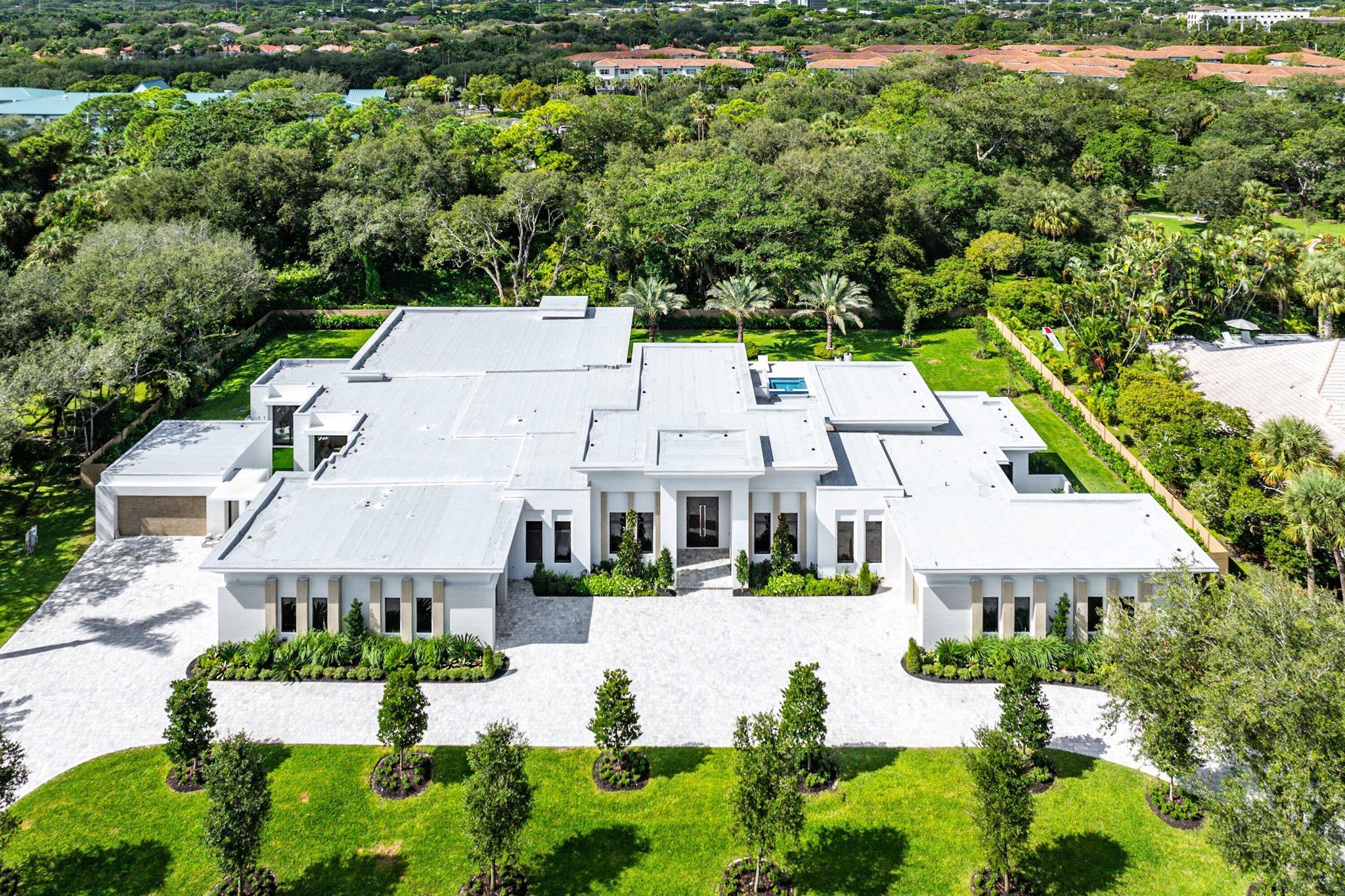 This sprawling NEW CONSTRUCTION estate is situated on one acre within the prestigious gated community of Foxe Chase, offering 12,500 square feet under roof with approximately 8,000 square feet of meticulously designed living space under air and a 7-car garage capacity. A harmonious blend of architectural elegance, modern technology, and master craftsmanship, this custom-built residence represents the pinnacle of South Florida luxury living. An impressive entryway leads into sun-drenched formal living spaces with soaring ceilings and refined architectural details. The thoughtful layout features five ensuite bedrooms, a wellness room off the primary suite, an elegant office, a sophisticated club room, a hidden scullery back kitchen, butler's pantry, dual primary baths, and a safe roomeach designed to balance comfort, functionality, and timeless sophistication.

The home features custom cabinetry by Zimmerman Kitchen Design in Boca Raton, manufactured locally by Milano in Miami, Florida. Each piece exemplifies local artistry, crafted with precision, bespoke finishes, and seamless integration throughout.

A professional-grade appliance suite from Wolf, Sub-Zero, Thermador, Zephyr, and XO anchors the culinary spaces, offering dual Sub-Zero refrigeration systems, Wolf professional ranges and steam ovens, and panel-ready dishwashers. Multiple prep and entertaining zonesincluding a chef's kitchen, butler's pantry, and outdoor summer kitchenmake the home ideal for both grand entertaining and everyday living.

The residence is equipped with four Carrier air conditioning systems totaling 16.5 tons of cooling capacity, tankless water heaters, and a whole-home 48 kW Generac generator powered by natural gas, ensuring uninterrupted performance for all systems, appliances, and HVAC.

The outdoor oasis features an 18' x 36' saltwater pool paired with an 8' x 10' spa with eight therapeutic jets, a Jandy pool heater, smart automation controls, and Hydrocool LED color-changing lighting. Automatic fill and overflow systems maintain optimal water balance, while depths ranging from 3 to 6 feet offer resort-style relaxation.

Every element of this home has been engineered for connectivity and convenience. The property is prewired for full smart home automation, featuring dual equipment racks, whole-home audio/video distribution, 10 prewired TV locations, 15-camera surveillance, automated shade wiring, and indoor/outdoor Wi-Fi coverage. A Lutron RadioRA 3 lighting and shade system integrates with major smart home and voice platforms, offering personalized lighting scenes, remote app control, and effortless ambiance throughout.

Offered fully furnished, this residence exemplifies the ultimate in turnkey luxurycombining curated interiors, advanced home technology, and masterful craftsmanship into one extraordinary Foxe Chase estate that truly redefines modern elegance.

DISCLAIMER: Information published or otherwise provided by the listing company and its representatives including but not limited to prices, measurements, square footages, lot sizes, calculations, statistics, and videos are deemed reliable but are not guaranteed and are subject to errors, omissions or changes without notice. All such information should be independently verified by any prospective purchaser or seller. Parties should perform their own due diligence to verify such information prior to a sale or listing. Listing company expressly disclaims any warranty or representation regarding such information. Owner is family member of listing agent.