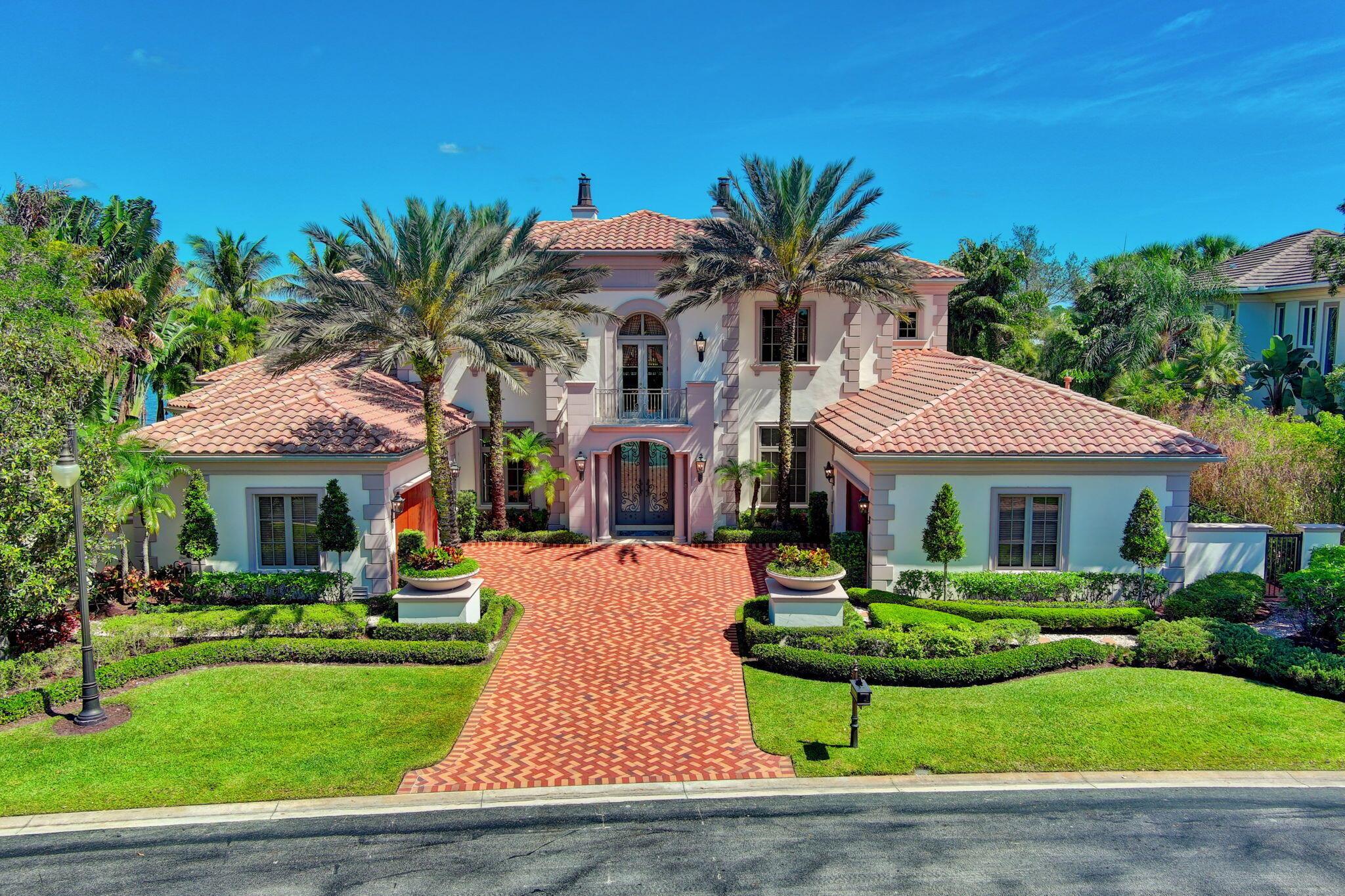 Experience the pinnacle of luxury living at 109 Playa Rienta, located in the prestigious Country Club at Mirasol in Palm Beach Gardens, Florida. This stunning estate home offers unparalleled elegance and quality, boasting picturesque views overlooking a large, serene lake nestled within the lush greenery of the golf course community.
As you step through the grand double glass doors, you'll be greeted by exquisite architectural details that define this home's unique charm. The expansive living space spans 8000 square feet, featuring five spacious suites, including a lavish master bedroom with his and her baths. The office is a masterpiece, with beautifully paneled walls and a cozy fireplace, creating an ideal space for working from home.

GOLF MEMBERSHIP Experience the pinnacle of luxury living at 109 Playa RIenta, located in the prestigious Country Club at Mirasol in Palm Beach Gardens, Florida. This stunning estate home offers unparalleled elegance and quality, boasting picturesque views overlooking a large, serene lake nestled within the lush greenery of the golf course community.

As you step through the grand double glass doors, you'll be greeted by exquisite architectural details that define this home's unique charm. The expansive living space spans over 8000 square feet, featuring five spacious suites, including a lavish master bedroom with his and her baths. The office is a masterpiece, with beautifully paneled walls and a cozy fireplace, creating an ideal space for working from home.

Entertain guests in the oversized kitchen and family room, offering ample space and top-of-the-line appliances. The home's transitional design seamlessly blends traditional and contemporary elements, creating a timeless appeal. 

For leisure and entertainment, the home includes a media or theater room, perfect for movie nights or relaxing with loved ones. Upstairs, you'll find spacious bedrooms, loft and a layout designed for comfort and convenience.

Step outside to your own private oasis, featuring an infinity-edge pool that appears to flow seamlessly into the lake below. Relax on the screened-in lanai or soak in the hot tub, surrounded by the natural beauty of Florida's landscape.

This home is perfect for those seeking the ultimate in luxury living, with access to the finest amenities. Don't miss the opportunity to own this exquisite estate in one of Florida's most coveted communities. GOLF MEMBERSHIP