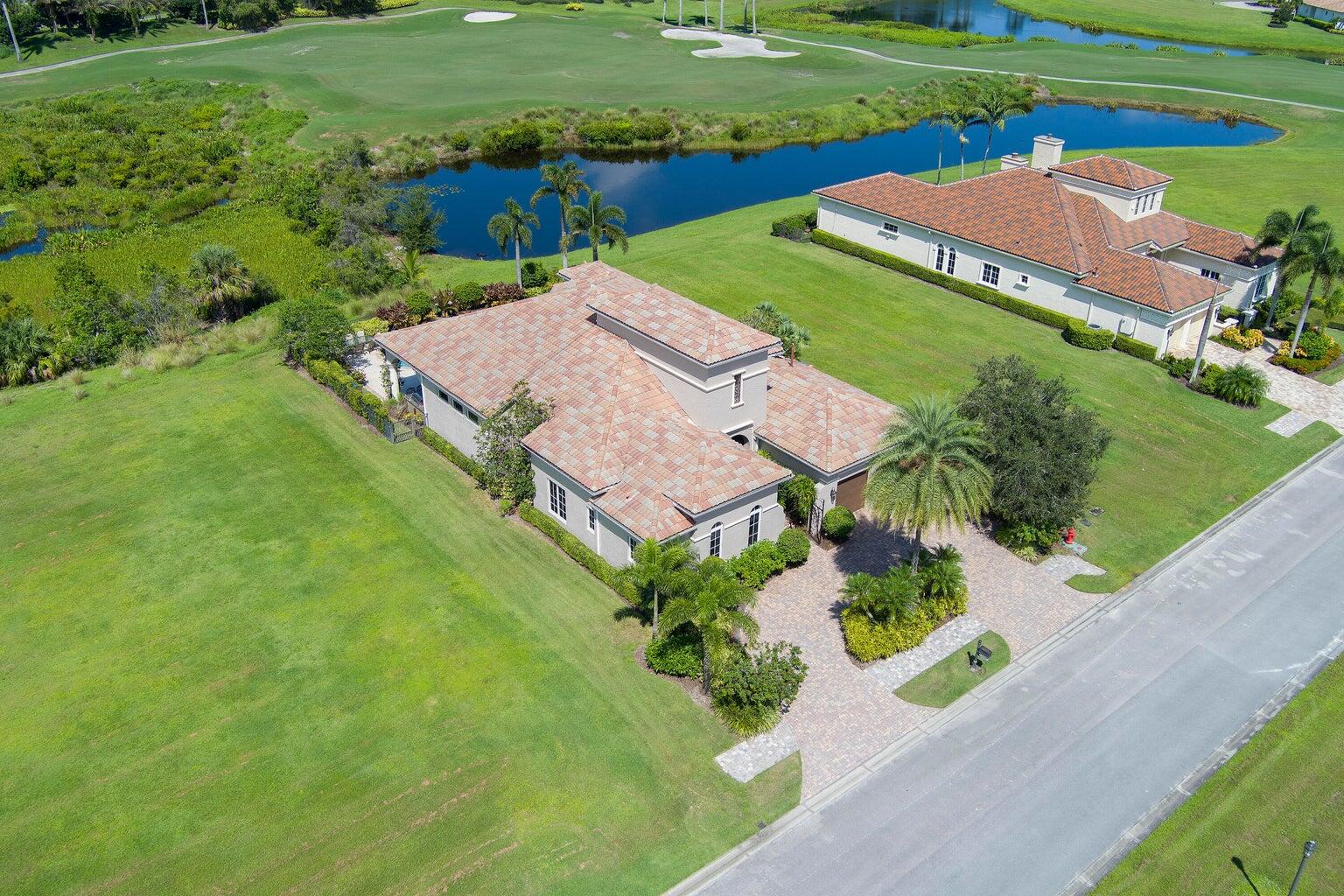 This turnkey fully furnished Tuscan-style home with a fantastic pool is ideally suited for entertaining. The extended covered porch features an outdoor kitchen with a natural gas grill & overlooks a resurfaced lap pool with a hot tub; the fire pit offers views of a preserve, the 16th fairway, and a pond. 5 French doors lead from the porch into the Great Room & kitchen. Ideally suited for entertaining. The Private Den & Dining Room features tall ceilings & windows. The Guest Bedrooms with ensuite baths, designed for maximum privacy, have been updated with new carpets. The Main BR suite has a 14 ft high tray ceiling, both his & her private baths, & 2 walk-in closets featuring custom cabinets. Updated AC's, New pool heater, Tankless water heater, EV Car & Golf Cart charger, 400 amp electric.