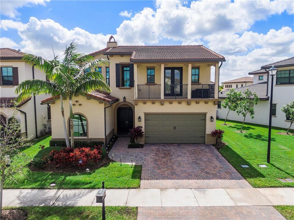 This beautiful Provence model is located on a prime water lot with wide water views in Watercrest, one of Parkland's most sought after gated communities! Features include a foyer entrance, formal dining  /office, casual dining, great room, a downstairs master suite and a spacious loft!  The kitchen offers stainless steel appliances, granite counters, center island, pantry, wood cabinets and a glass tile backsplash! Entertain under the covered patio with retractable screen, built-in grill and hot tub. Swim in your own backyard paradise in the tropical salt water pool with a sun shelf and travertine decking while watching the sunrises and sunsets! This community offers amazing amenities, low HOA fees and great area schools! This is truly South Florida Living at its best!!!