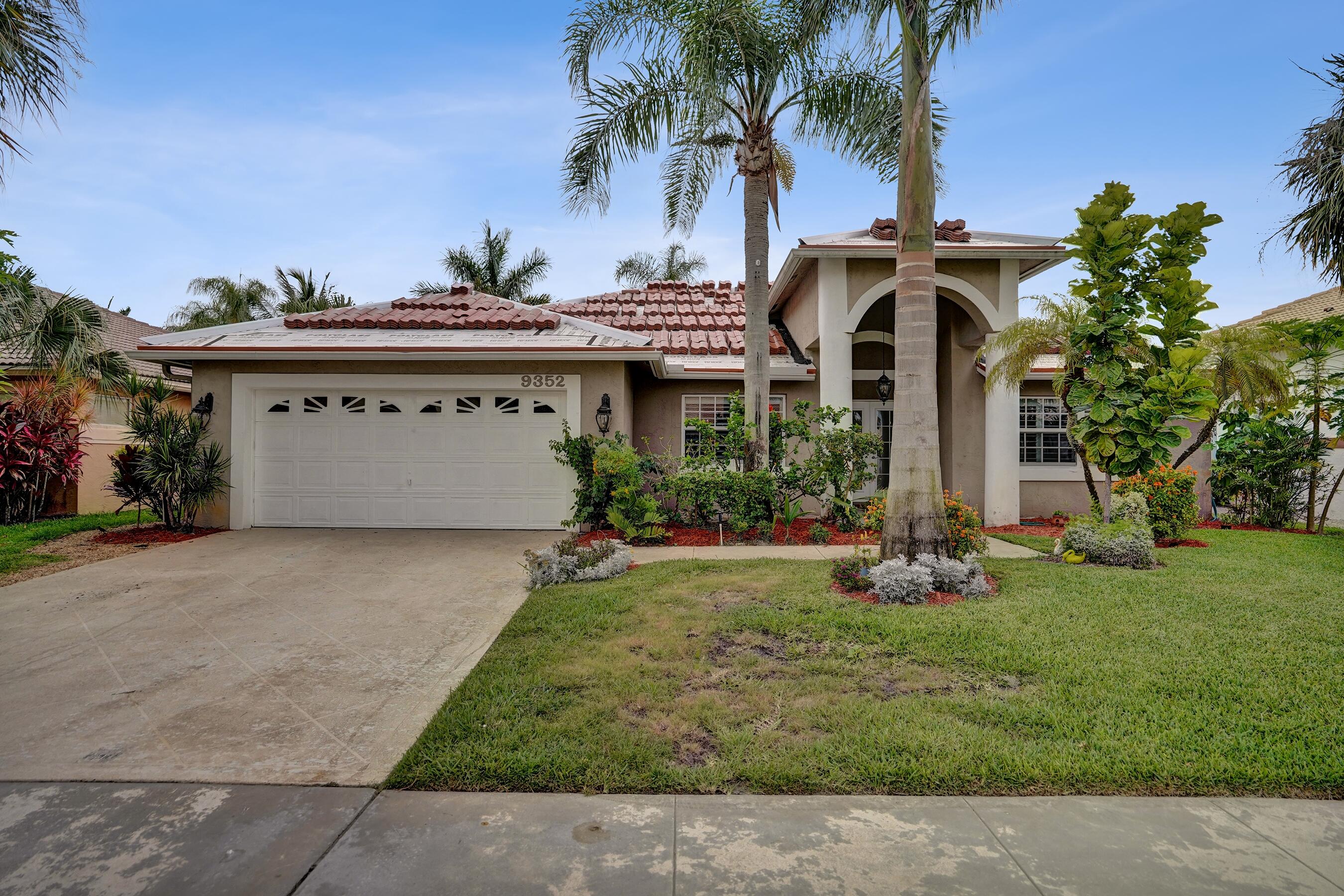 Welcome to Boynton Waters, a desirable gated community in Boynton Beach! This 3-bedroom, 3.5-bath pool home offers water views, a screened patio, and tropical landscaping with banana & coconut trees. Each bedroom features its own private full bath, while the spacious master suite includes a jacuzzi tub and separate shower. Enjoy a 2-car garage, low HOA fees, and a NEW TILE ROOF currently in progress. Conveniently located near shopping, dining, beaches, golf, and major highways. Qualified VA buyers may have the opportunity to assume the seller's low 3.65% VA loan. Don't miss this exceptional Florida waterfront lifestyle opportunity!