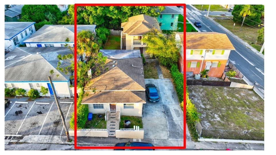 Rare investment opportunity with a front single-family home (3/1, approx. 1,600 SF) and a two-story duplex in the rear. Duplex includes a 4/2 upstairs $2,000 per month lease expires 6/30/27.  3/1 downstairs $1,800 until April 2027.  Front house leased for $2,400 month-to-month creating flexibility for rental increases or future redevelopment.  Total rents up to $6,200 or more.  Front home features A/C (2018), . Rear units include newer wall A/Cs and water heater (2016). Below-market rents provide built-in value-add. Drive-by only--please do not disturb tenants. According to the West Palm Housing Authority, market rates for a 3-bedroom unit are $2,590 and for a 4-bedroom unit are $3,130. Additional Features: Utilities: Three separate electric meters, one shared water meter (average $300 per month) Lawn care: Approximately $60 per month Investment Highlights: Immediate Upside: Rents are currently below market, with the opportunity to increase to align with West Palm Housing Authority rates, totaling $8,310 per month across all units. Strong Rental Demand: Close to employment hubs, Clematis Street, and major transit routes including I-95, Brightline, and Palm Beach International Airport. Area Revitalization: Northwood is undergoing significant redevelopment, leading to increasing property values and rental demand. Strategic Location: Steps from the Northwood Historic District, 1.8 miles from downtown West Palm Beach, and minutes from the Intracoastal. Why Invest Here? This property offers strong rental income potential, a prime location, and long-term appreciation, making it an excellent investment for steady cash flow and future growth. Whether you are looking to maximize rental income or owner-occupy a unit, this opportunity provides flexibility and potential in one of South Florida's most promising markets.