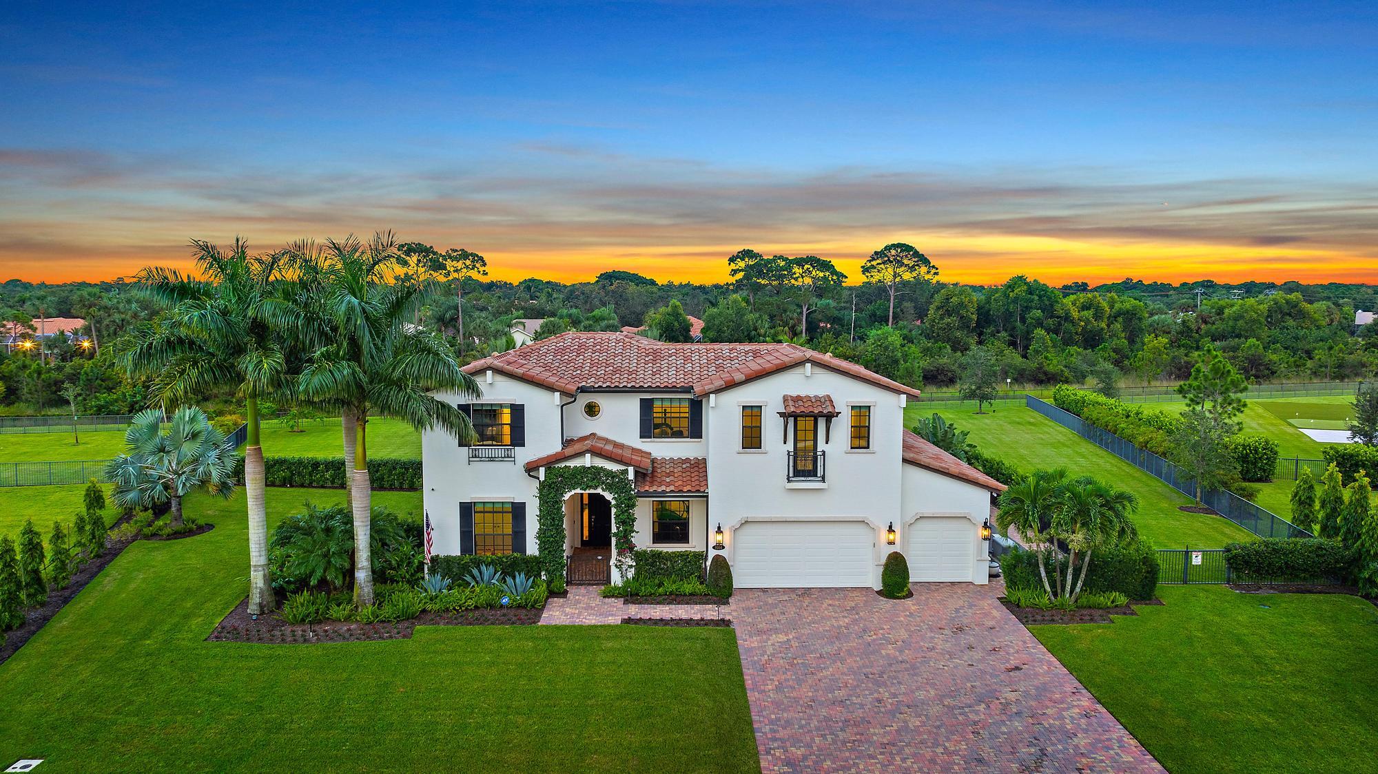 GORGEOUS, 5-bedroom + home gym and loft, 5.1-bathroom estate located in the esteemed and gated community of Prado in Jupiter, Florida. This Alexandria model, built in 2018, sits on just over 1 acre and offers more than 4,500 sq ft of luxury living space. With soaring high and coffered ceilings, marble flooring throughout the first floor and wood upstairs, a stunning white kitchen with high-end appliances, and the ultimate backyard boasting a heated pool and spa, covered patio with the automatic screens, outdoor fireplace and full summer kitchen - this home is designed for ultimate enjoyment and entertaining! As you enter through the grand front door, you're greeted by soaring ceilings and marble floors that extend throughout the first floor. The expansive family room flows effortlessly into the open kitchen and dining space, ideal for family dinners. The custom white kitchen boasts high-end appliances and finishes, including Quartzite countertops, Wolf 5-burner gas stove, double ovens, Subzero refrigerator, and a spacious island. Large glass sliders lead to the outdoor covered patio, making indoor-outdoor living seamless.

On the main floor, you'll find the home gym, the 5th bedroom with an en-suite bathroom (currently used as an office with a pull-out king-size sofa bed), and a convenient full cabana bath with granite countertops and a frameless glass shower. The large laundry/mudroom and 3-car garage provide ample storage and utility.

Your primary suite is a private sanctuary, complete with marble floors as well as his-and-her walk-in closets with built-ins that offer an ample amount of storage. The spa-like en-suite features a soaking tub, a walk-in shower, dual vanities with white quartz countertops, and espresso cabinetry.

Head upstairs to find an open loft area, perfect for a kids' or guests' family room, along with 3 additional bedrooms. Two with a jack and jill shared bath, beautifully updated with double sinks, quartz countertops, and a frameless glass shower. The additional expansive bedroom with its own en-suite bath and a large walk-in closet rounds out the second floor, along with a half bathroom and an additional stackable laundry closet for added convenience.

Step outside to your private east facing backyard oasis, where you can enjoy breathtaking sunrises with your morning cup of coffee. Fully fenced and designed for year-round enjoyment, the heated pool and jacuzzi sit on an oversized travertine deck with a cozy wood-burning fire pit nearby. The covered patio features a pecky cypress ceiling, wood-burning fireplace, category 5 grade electric screens, and a full summer kitchenperfect for entertaining. Additional outdoor highlights include complete surround sound speakers both in and outdoor with separate zones for a mix of music, a mosquito misting system and a whole-house generator for added peace of mind.

Prado offers a convenient location close to all the top notch restaurants, shops and pristine beaches in the Jupiter area as well as being close to I-95 and the Turnpike.

Make this luxurious estate your home in Jupiter and don't miss out on this incredible opportunity!