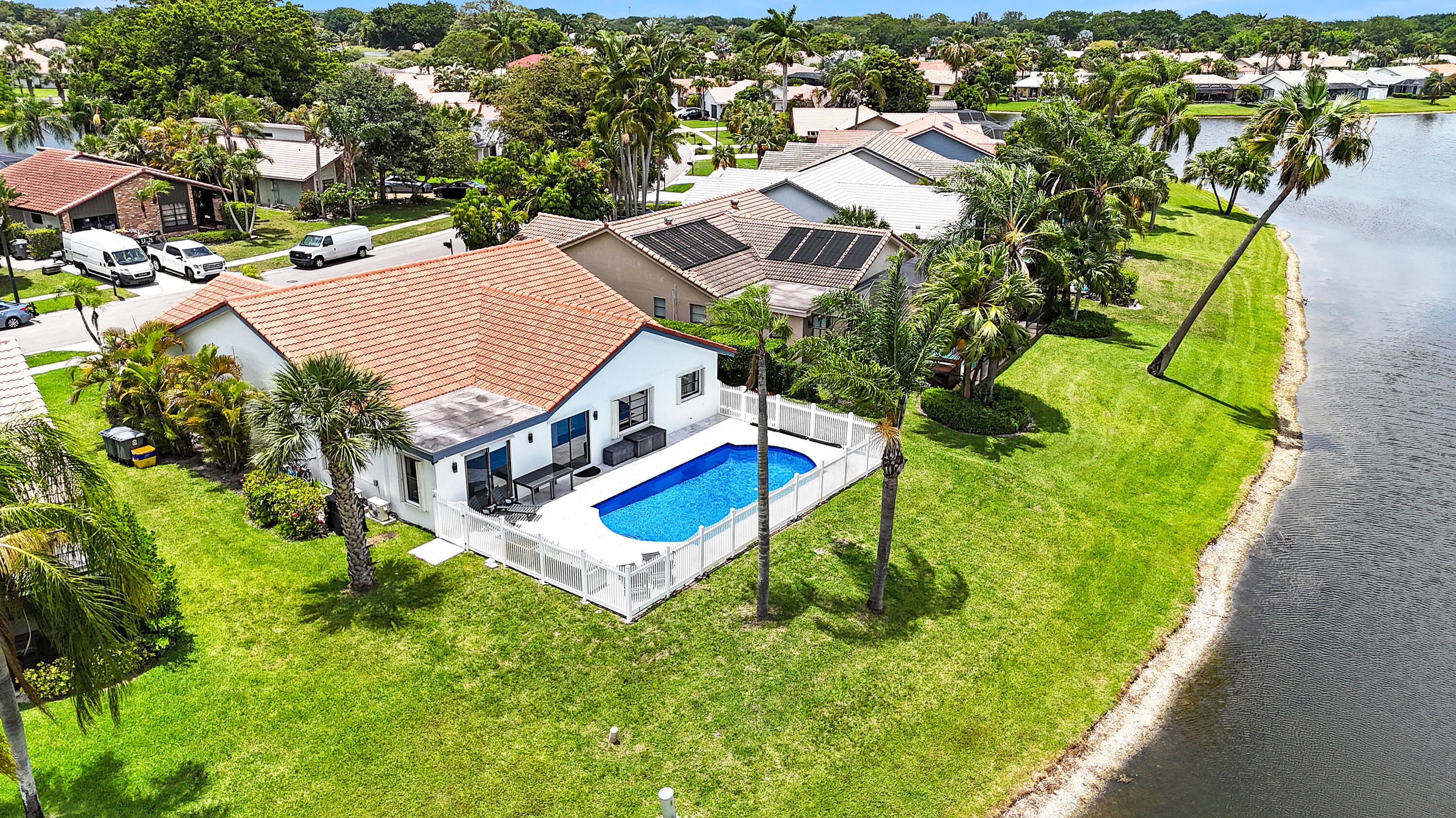 Stunning fully renovated 5-bedroom, 3-bathroom home in the manned-gated community of Boca Greens. This beautifully updated residence boasts a gourmet kitchen with double sinks, central air conditioning plus three split AC units, and smart remote controls for AC's, lights, and garage door. The oversized 400 sq ft single-car garage is also air-conditioned. Outside awaits your private oasis...a gorgeous heated pool and expansive deck offering serene lake views. Nestled in a meticulously maintained neighborhood directly adjacent to the 870-acre South County Regional Park, residents enjoy a 27-hole golf coarse, water park, tennis, pickleball, sports fields, dog park, playground, nature center, amphitheater, and more. Move-in ready with luxury upgrades in one of Boca Raton's most desired areas. Great Location + 5 bd, 3 ba + Stunning Pool & Garage + Excellent Condition + Low Maintenance = VALUE!