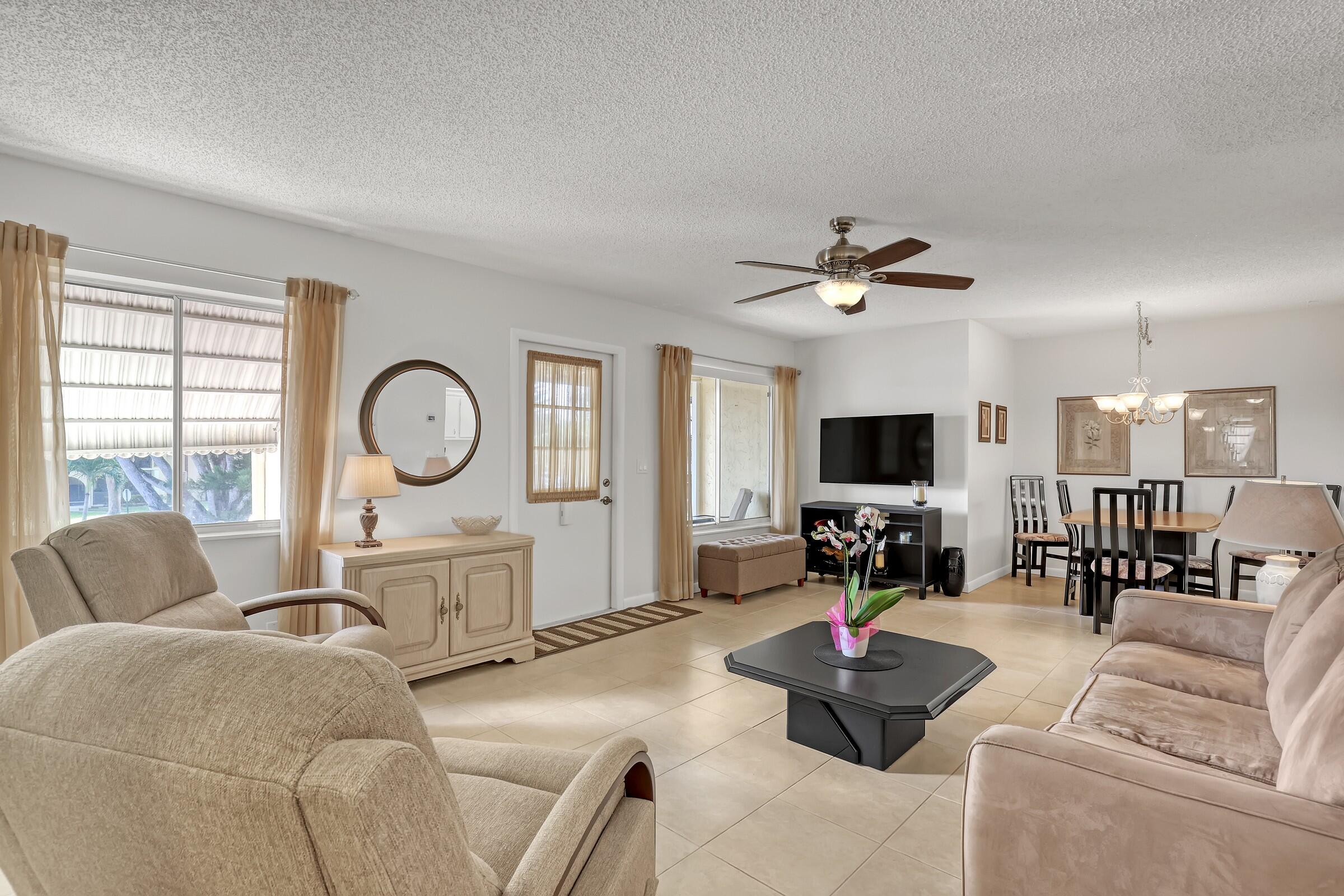 Welcome to Pine Ridge III, a vibrant 55+ community conveniently located near Palm Beach International Airport. This move-in-ready 2-bedroom, 1-bath condo is offered fully furnished and features an updated bathroom and granite kitchen countertops. Enjoy the convenience of your assigned parking space directly in front of the entrance and a location just steps from the clubhouse.  A hidden gem with affordable monthly fees offers an array of amenities including pickleball, tennis, shuffleboard, bocce, social room, library & luncheons hosted by the Men's & Women's Clubs. Relax or swim laps in the heated pool. Ideally situated near world-class shopping, golf, beaches, cultural activities, medical facilities & Palm Beach International Airport. All furnishings are included with the purchase.