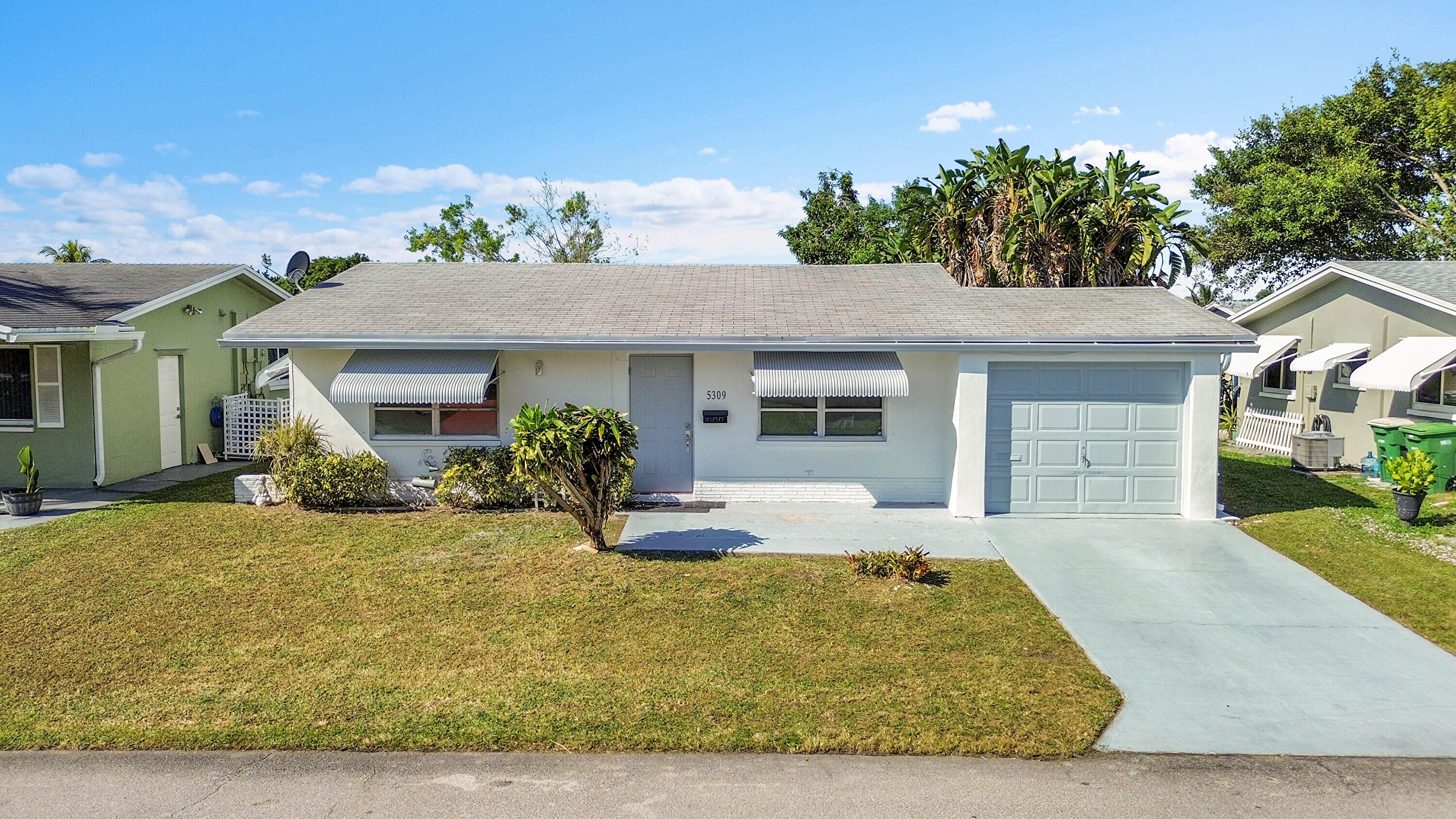 Beautifully remodeled 2BR/1BA home with a 1-car garage in the peaceful and highly desirable 55+ Mainlands 6 community. This turnkey property was upgraded with care, featuring a stylish new kitchen with modern cabinets, updated appliances, and a custom coffee station perfect for easy mornings. Enjoy fresh interior paint, sleek tile flooring throughout, and a fully redesigned bathroom with tasteful finishes. Major improvements include a 2020 roof, 2020 A/C, and a brand-new MyQ smart garage motor that lets you control access from your phone. Located in a quiet, well-kept neighborhood close to shopping, dining, and major roadways, this home offers low-maintenance, comfortable Florida living in one of Tamarac's most welcoming senior communities. Move-in ready and easy to show.
