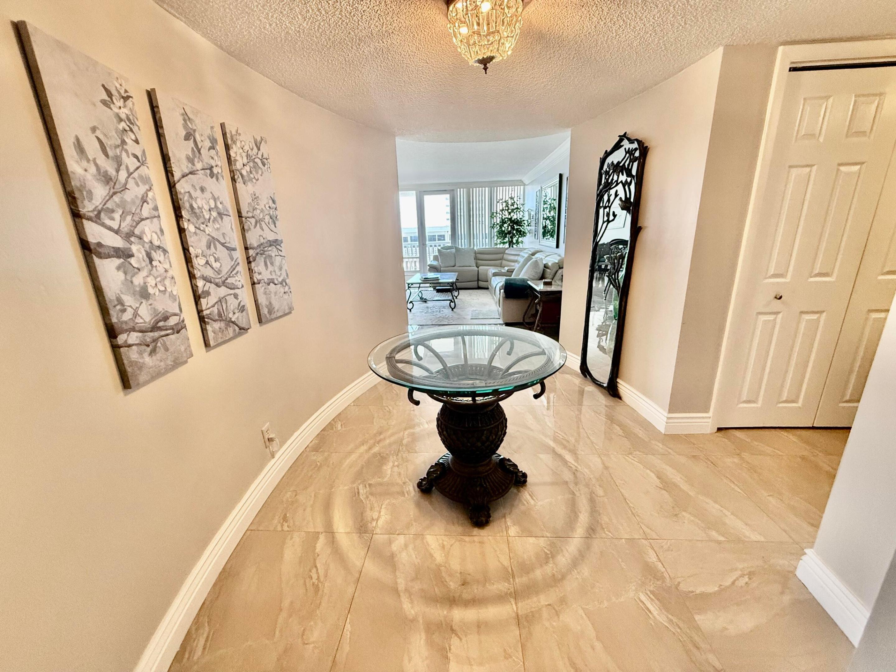 Located on the famous Galt Ocean Mile this 2BD/2BA waterfront residence  has 1,907 sq ft  & offers remarkable views and the amenities of  a resort.  From the elegant foyer the thoughtfully designed floor plan offers an updated open kitchen with breakfast bar, stainless appliances, spacious living & dining room & floor to ceiling windows throughout with incredible views of both the ocean & intracoastal. The primary suite has  walk in closets and lots of additional storage areas.  The large guest bedroom is tastefully furnished & features dual walk in closets.  The entire rooftop is a vacation oasis w/expansive ocean views, sparkling pool & individual cabanas for your privacy.  Resort like amenities incl gym, sauna, tennis & wrap around walking path. Located close to shops & restaurants.
