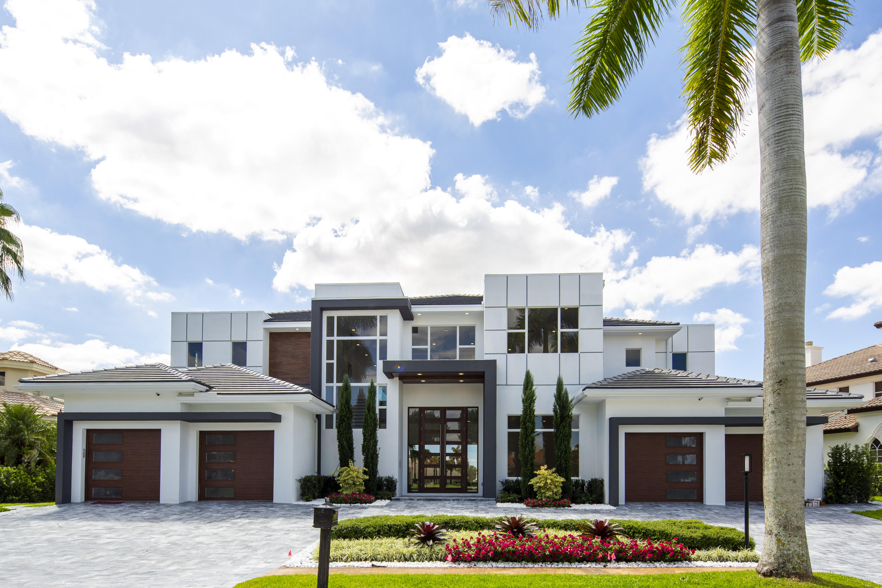 ONLY NEW CONSTRUCTION PROPERTY WITH LAKE VIEW!!! $585,000 PRICE REDUCTION. MOTIVATED SELLER. 
Distinguished by spectacular exterior and interior architectural elements, this prestigious contemporary residence features 6 bedrooms, 7 full baths, 2 half baths and approximately 7,257 sq ft of air conditioned living space. The first floor includes a formal living room, formal dining room, a gourmet chef's kitchen with state of the art appliances, breakfast room, large family room all designed for effortless entertaining or casual living. The master wing includes a grand master suite with luxurious his and her marble baths, including a steam shower in his bath and generous closets. An office and maid's room complete the downstairs level. 4 ensuite bedrooms, a large game lounge, and media room complete the upstairs. The lushly landscaped property features a dramatic resort styled pool and spa, covered loggia with summer kitchen, and breathtaking lake vistas and golf course views. Other features include hurricane resistant windows and doors, full house generator, elevator, and 4 car garage. 

This home is designed to exceed the high wind standard of Miami Dade County by using reinforced concrete block construction on the first and second floors of the home including few interior walls. The 2nd floor is made of HOLLOWCORE precast system with a 10" concrete for the best stability and sound transmissions. The house is built 5' above the crown of the road for an extremely low chance of flooding, storm drains are built all around the house and run to the lake for the rain water not to stay on the ground.

WINDOWS AND DOORS: All glass windows, exterior doors, panoramic stackable pocketed 11' sliders in the living room and 12' entry double doors are made with high performance "SIW" impact low-e tinted glass that controls heat from transferring into the home which is 55% more efficient than regular impact glass with a lifetime warranty.

"RTI" SMART HOME TECHNOLOGY: State of the art American made smart system that is a lot more sophisticated and expandable than a Control 4, with Alexa voice activation that controls lighting, air conditioning, music, TVs, shades, draperies, pool, cameras, doorbell, etc. Customizable apps to control smart home systems from smartphones and portable devices.

SECURITY SYSTEM, SECURITY CAMERAS: AND INTERNET CAPABILITIES: Professional grade IP NVR Camera Systems with 1 Terabyte Storage drive and eight (8) high resolution 4MP Camera, with camera ready doorbell that lets the owner monitor the house at all times, with alarm notifications and video playback directly on your phone. All CAT6 low voltage wiring runs back to a central hub equipment rack location for a fully centralized solution with video distribution prewire throughout the house.

GENERATOR AND GAS APPLIANCES: The home is equipped with a whole house generator with an automatic transfer switch and a 500-gallon buried LP tank.

POOL AND SPA: The pool (15'X30') and spa (8'X8") were designed to highlight the grand views of the long lake and the outdoors living area. The pool and spa have a combination of 5 colored LED lights, a Hayward automation control all functions through WIFI, including the heat pump, blower, multi-speed pump, salt system and 4 deck jets with a separate pump system.

ELEVATOR: Classic Series made by Residential Elevators complete with soft-start and soft-stop technology, a 950-pound lifting capability, LED lighting system and a two-year warranty on all parts.

APPLIANCES-KITCHEN:
WOLF 60-inch slide in gas range with 2 full size ovens
Two (2) SUBZERO 36-inch refrigerator/freezer
Two (2) ASKO dishwashers with integrated panels
WOLF coffee maker
WOLF microwave
48" Stainless ventilation with make-up air
Lifetime Warranty BBQ grill
SUBZERO wine cooler

FLOORING: The flooring throughout the house is real wide planks French wire brushed oak wood. Her master bath is white haze marble on all walls, floors and shower ceiling. His master bath is all crystal marble on walls, floors and ceiling. Outside pavers are ocean blue marble. Balconies and garages are Italian made through body porcelain that is 10 times stronger than regular porcelain tiles.

CABINETRY: The kitchen is made by European Hans Krug with premium lacquer. 12 layers of lacquer: five base layers of acrylic lacquer are applied to all sides, then two final layers of polyurethane lacquer are applied with either glossy or matte finish. Heat Resistant to temperatures up to 932 degrees Fahrenheit. Water and Humidity Resistant: Using PUR-TERMOSET technology Harmless to Health: sealed surfaces prevent the release of formaldehyde (emission class E1LE and has CARB Phase 2 certification). 20 year warranty on the finish.The backsplash is a book match marble and oversized 8'X14' quartz countertops.There is a hidden pantry. All closets are custom built cabinets to the ceiling. Bathroom cabinets are floating custom built with lacquer. All PVC exterior cabinets for the BBQ area.

INSULATION: Icynene insulation is sprayed to the underneath side of all the plywood and to the top of the trusses. This keeps the attic space cool and dry for more efficient air conditioning duct cooling. The system also acts as an additional air and sound barrier between the outside and the living space. Notice there are no eave vents in this home.

GARAGE DOORS: The garage doors are manufactured by Clopay and have some of the highest wind strengths in the industry. This series of steel door, glass and hardware is impervious to moisture, will not rot, warp or crack. The steel used is made from over 75% recycled content and the doors are made in the United States. Lift Master operators have a five year warranty on the motors and include child and pet safety features.

UTILITIES: WATER: City water. GAS: Propane gas tank with 500 gallons of capacity

EXHAUST FANS: All bathroom exhaust fans are Energy Star rated and are ultra-quiet fans. The kitchen exhaust system includes an automatic return air make up system that balances the air pressure inside the home when the exhaust system is activated.

DRYWALL: All drywall is 5/8" fire rated board. Additionally, all bathrooms have Durock concrete mold resistant board for extra protection in wet areas. All wall framing is 16 inches on center as opposed to the industry standard of 24 inches, creating stronger walls with greater load capabilities.

PLUMBING FIXTURES: Hansgrohe, Toto Neorest $4000 toilets in his and her bathrooms, Toto and Villeroy and Boch for all other bathrooms, Itialian Teuco $12,000 tub in master bathroom with the same Italian brand Teuco fixtures and sink, commercial steam unit installed in his bathroom, 2 X 80 galloon water heater installed on each floor with recirculating pumps.

LAUNDRY ROOM:
2 laundry rooms with full size washers and dryers on each floor, with custom built liquor and shake cabinets, sinks, Hansgrohe faucets and quartz countertops.

INTERIOR DOORS AND MILLWORK:
Sold core 8' doors throughout the home, 8" baseboards, 4"casings.