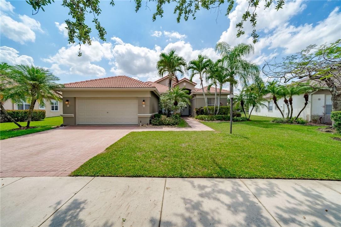 Welcome to this immaculate 5-bed, 3-bath Coral Reef model in the highly sought-after Parkland Isles gated community. This home has had custom work done and is unlike any other model in the community. Enjoy breathtaking lake views from your serene backyard with a beautiful pool, perfect for entertaining. The $65K+ completely remodeled kitchen includes high-end appliances, custom cabinetry, LED lighting, beautiful countertops & backsplash with waterfall island. This home is equipped with hurricane doors & shutters for safety, 15000W NSTAR GENERATOR, while elegant marble and laminate floors throughout add sophistication. Located in an A-rated school district with low HOA fees, this immaculate luxury home offers affordable living. Community offers 24 hour manned gate, clubhouse with pool, fitness center, tennis/pickleball courts, basketball and playground area.
