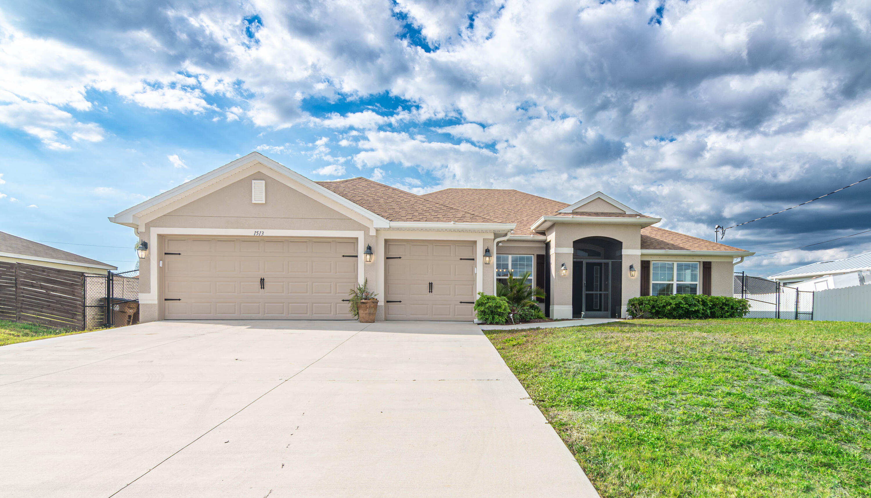 This move-in ready home is nestled in a quiet/family area in NE Cape Coral and showcases a unique, thoughtfully designed layout. Featuring 4 bedrooms plus a den and 3 bathrooms, it offers both space and flexibility for modern living. Soaring ceilings and a designer color palette create a bright, sophisticated atmosphere throughout. Enjoy the extended outdoor patio, perfect for relaxing or entertaining, along with the added benefit of a whole-home RO water system. Meticulously maintained and "like new," this home is ready to impress from the moment you step inside. Be sure to see the list of the Updates and Features listed with the photos.