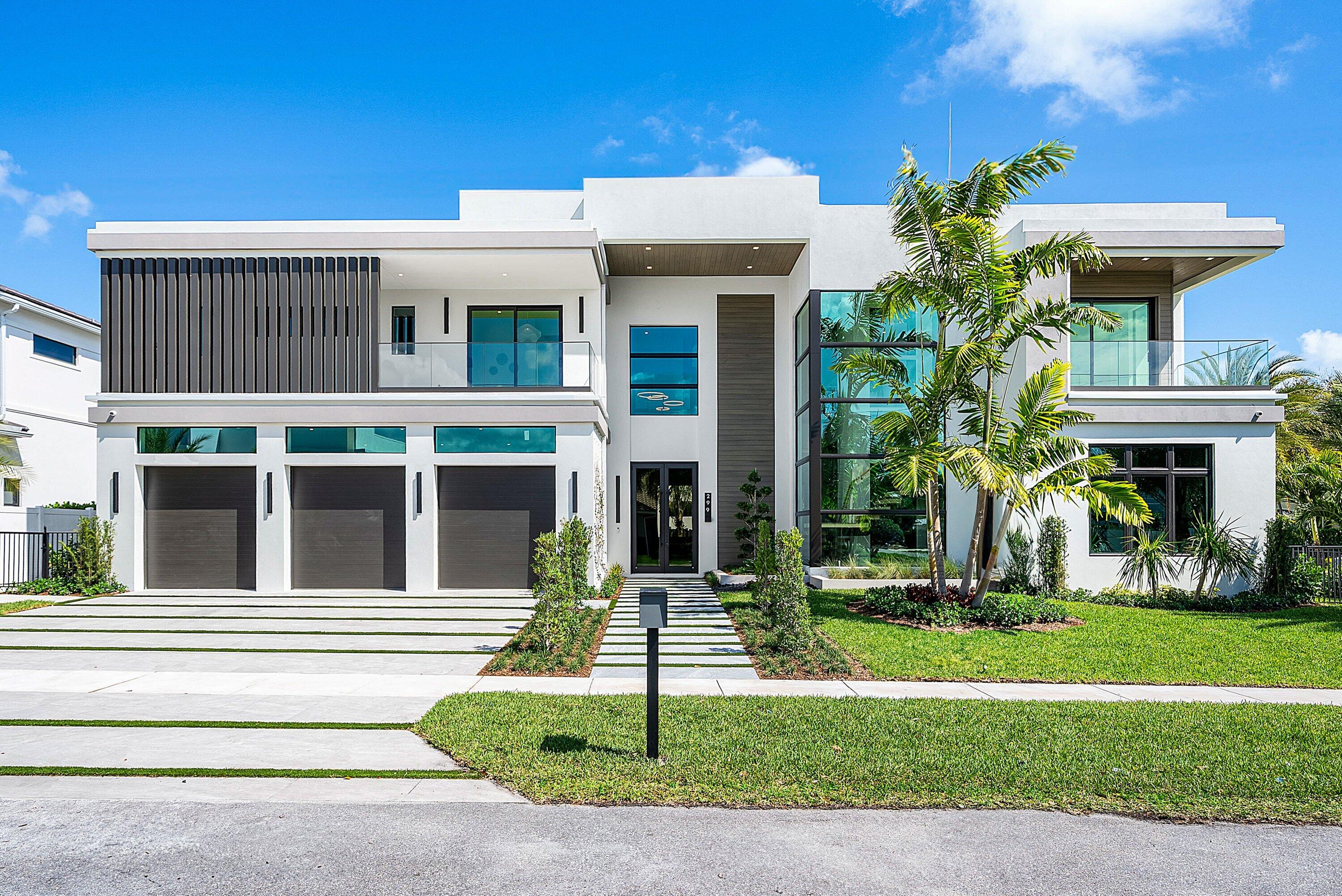 Introducing the crown jewel of Boca Villas -- a newly constructed architectural residence where elevated design, exceptional craftsmanship, and an unmatched walkable location converge. Built by the renowned Primo Luxury Homes and thoughtfully designed by Ariana Tascione, this extraordinary corner-lot estate is poised to become the crown jewel of the neighborhood. Perfectly positioned just steps from the ocean and moments from The Boca Raton, Mizner Park, Royal Palm Place, and the vibrant shops and five-star dining along East Palmetto Park Road, this residence offers an unparalleled lifestyle where luxury, location, and design converge. Spanning 5,815 square feet under air and 9,344 total square feet, the home showcases five bedrooms, five full and one-half baths, a private office, club room with custom bar, dedicated gym space, and two full laundry rooms for ultimate convenience. One bedroom suite is ideally located on the first level for guests. From the moment you enter, the home reveals a seamless blend of sophisticated architecture and modern elegance. Elevated, designer-selected finishes and exceptional craftsmanship are showcased throughout, with custom detailing, refined materials, and a level of quality rarely found in new construction. Expansive living spaces are enhanced by cove lighting and integrated LED illumination, while walls of glass frame the outdoor living areas and flood the interiors with natural light. The showpiece double-island kitchen is designed for both entertaining and everyday living, complemented by a walk-in butler's pantry offering abundant storage and preparation space. The primary suite is a private retreat featuring two expansive custom closets, spa-inspired baths, and access to one of the home's three oversized balconies, creating a true sanctuary above the city. An all-glass elevator connects every level of the residence, while the upper-level loft offers a versatile gym or sitting lounge, opening to a spectacular balcony complete with a sun-filled solarium. Outdoor living is equally impressive. A resort-style pool and spa anchor the backyard, surrounded by multiple entertaining spaces including a summer kitchen and outdoor barbecue area, ideal for al fresco dining and gatherings year-round. Adding to the home's flexibility is a separate cabana/guest house, perfect for visitors, extended family, or a private retreat. Additional highlights include:  " Three-car garage with expansive driveway " Partially integrated smart home technology " Three oversized balconies for seamless indoor-outdoor living " Club room with full bar designed for entertaining " Corner lot offering exceptional presence and natural light This remarkable residence offers the rare opportunity to own a newly built architectural masterpiece in one of Boca Raton's most desirable walkable neighborhoods -- moments from the beach, world-class dining, and the best of downtown Boca.