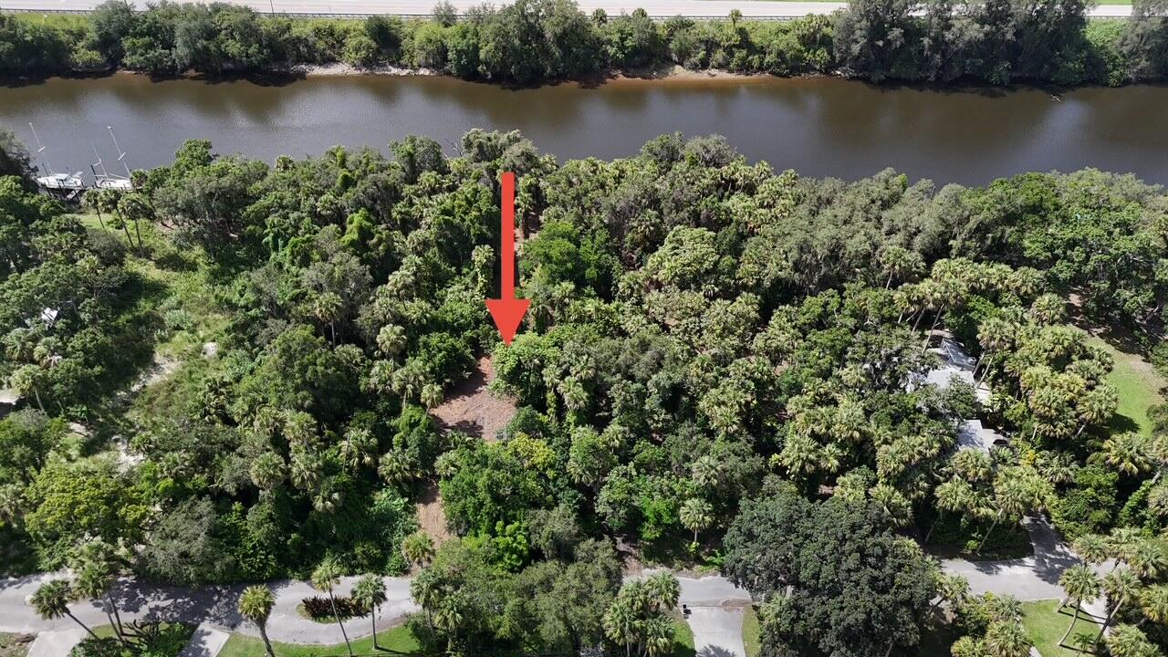 Build your waterfront dream home in the secluded River Oaks neighborhood of Indiantown. This nearly half-acre lot offers a peaceful setting with large mature oaks and direct ocean access in the growing Village of Indiantown, located in West Martin County. Enjoy convenient navigable waterway access that connects the Gulf of Mexico to the Atlantic Ocean via the Okeechobee Waterway and St. Lucie Canal. Located roughly 30 minutes from West Palm Beach, about 15 minutes to I-95 via Indiantown Road (with quick connections to the Florida Turnpike), and approximately 30-45 minutes to area beaches such as Jensen Beach on Hutchinson Island.