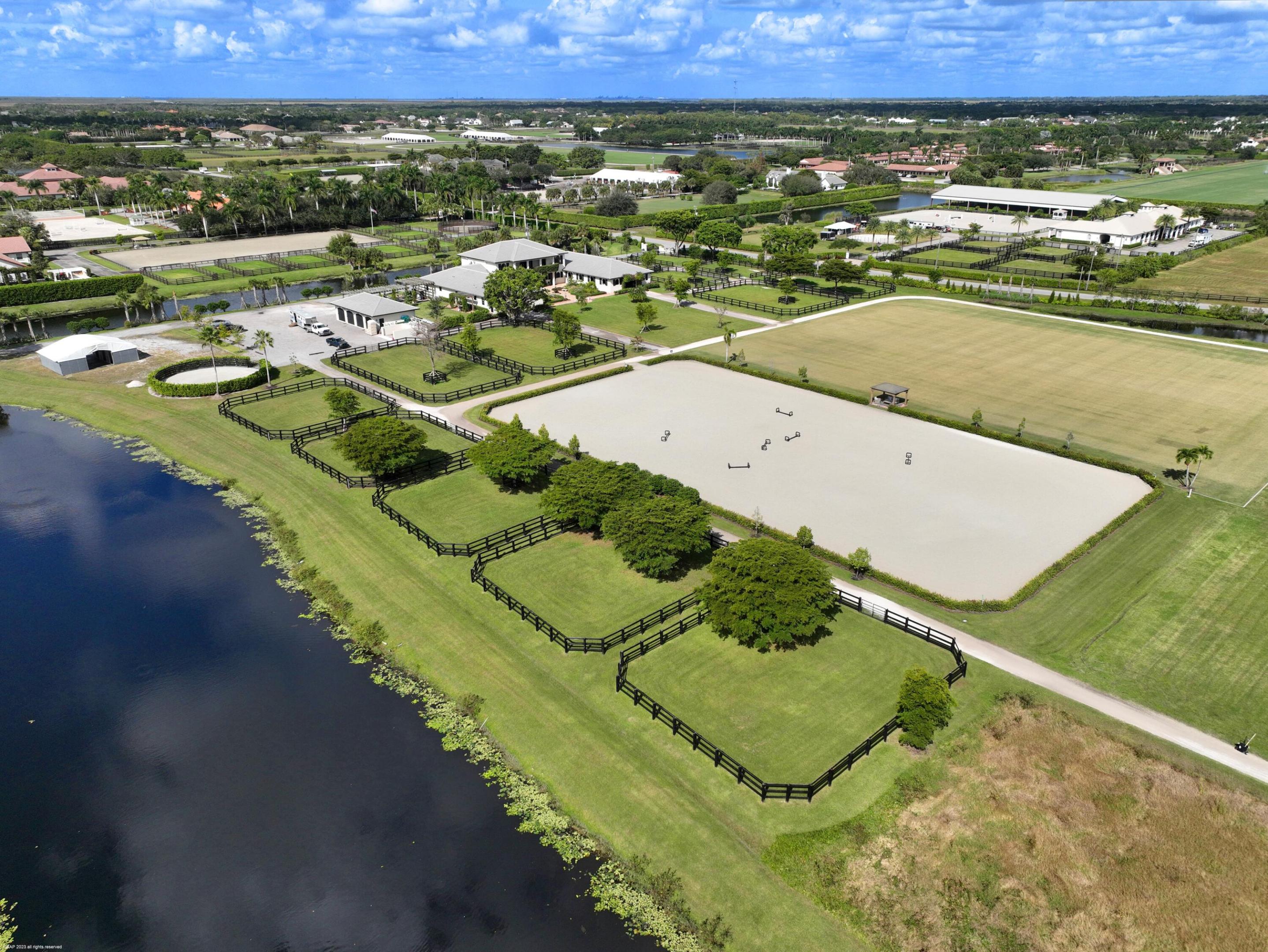 15 stalls available to one tenant at this magnificent training facility. Stalls are 12 x12 or larger (some double) with comfort mattress, aisle wide, private tack room, shared feed, laundry etc. Huge garage bay for storage. The showstopper of this farm is the 8 acre grass riding field, the oversized ring 140 x 250, and the 7 grass paddocks for the tenant. There is also a 4 bedroom grooms apartment (you can take only 3 of the rooms if you do not need 4) and plenty of room for parking. We can accomodate up to 3 trailers.  If you require more stalls, a tent for overflow can be provided. OWNER of the farm keeps 6 stalls for herself, tenant will be sharing the property.