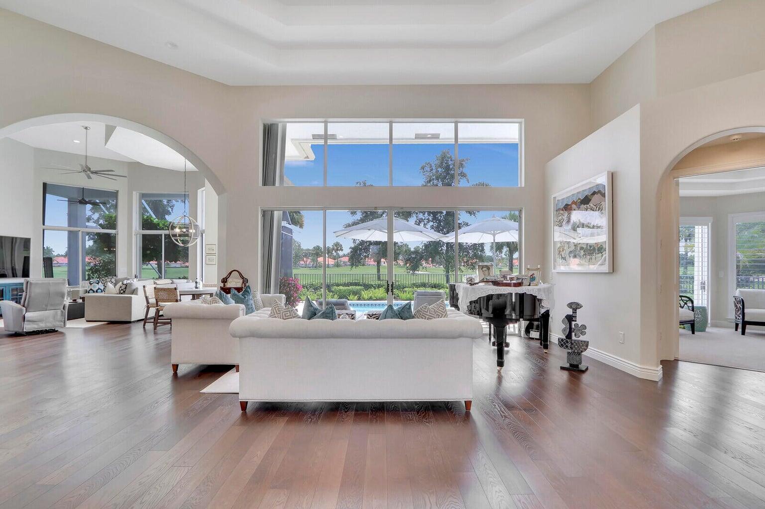 IMMEDIATE PREMIER GOLF MEMBERSHIP AVAILABLE WITH THE PURCHASE OF THIS PROPERTY. Offered fully furnished and beautifully updated, this move-in-perfect residence is ideally situated within one of The Club at Ibis's most coveted enclaves, commanding picturesque views of the first fairway of the Nicklaus-designed Legend Course. Positioned on a generous one-third-acre homesite with no cart path in sight, the property enjoys an exceptional setting of rolling green fairways, expansive skies, and abundant privacy. Featuring 3 bedrooms, 3.5 baths, and a private study, this light-filled residence offers a desirable open floor plan designed to maximize natural light and showcase the spectacular golf course vistas. From the moment you arrive at the circular driveway, the home's welcoming ambiance,  , spacious living areas, and beautiful views create an immediate sense of comfort and elegance. The oversized pool and screened lanai provide the perfect setting for both entertaining and relaxation, while the expansive homesite offers a rare sense of openness and tranquility. Beautifully updated and continually refined, this residence reflects years of thoughtful investment and modernization. Major improvements began with a substantial renovation approximately seven years ago, including the replacement of the roof and two HVAC systems, and have continued through recent years with a remodeled kitchen and updated appliances, custom closet installations throughout all eleven closets, whole-house water filtration, professionally enhanced landscaping and outdoor lighting, garage flooring, new gutters, a new hot water heater, and accordion hurricane shutters and upgraded screening installed just two years ago. The result is an exceptionally well-maintained home where the major work has already been done, allowing the next owner to simply move in and enjoy. Additional features include a spacious primary suite, generous guest accommodations, abundant storage, and quality finishes throughout. The sale includes virtually all furnishings, creating a rare turnkey opportunity for buyers seeking immediate enjoyment of the Ibis lifestyle without the time, expense, or inconvenience of furnishing a home. Located within The Club at Ibis, a Platinum Club of America, residents enjoy access to one of South Florida's most celebrated private club lifestyles. The club features a 90,000-square-foot clubhouse, three Nicklaus-family championship golf courses, exceptional dining venues, a world-class fitness complex and spa, and premier tennis and pickleball facilities, all complemented by an active social calendar and vibrant year-round lifestyle. The availability of an Immediate Premier Golf Membership further elevates this exceptional offering, allowing the next owner to bypass waiting lists and begin enjoying one of the finest private golf experiences in South Florida from the very first day of ownership.
