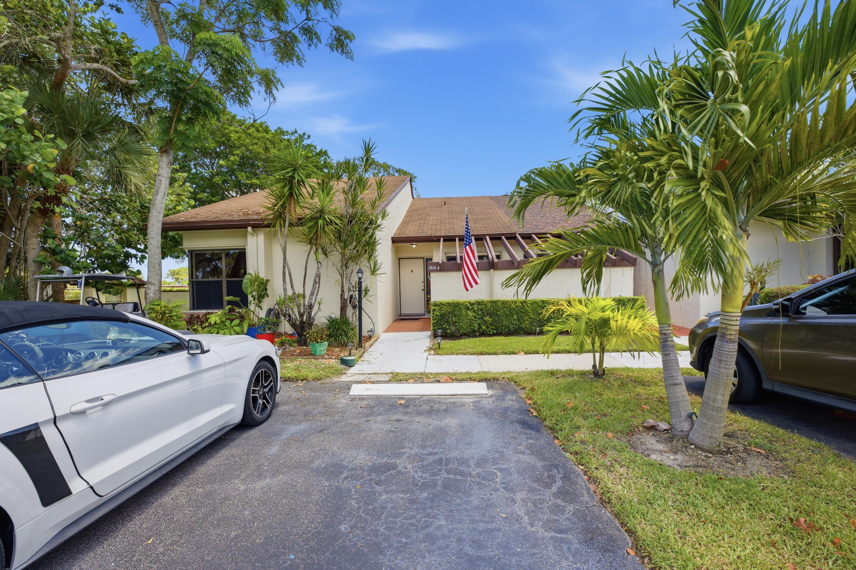 Sought after corner unit in Meed Racquet Club.  This unit also owns the adjacent lot.  The lot can be used but not built on.  This villa is in a unique place in the community; it's at the end of the street and can accommodate up to 6 cars when having people over.  It is one of the larger units in the community and currently has a den which could easily be converted into a third bedroom.  This corner unit is light and bright and has cathedral ceilings that give it an open expansive feel.  The kitchen has stainless steel appliances, a pass through to the dining room, a breakfast nook and sliders to the front patio.  The master has a large walk-in closet, and the master bath has a walk-in shower.  The back patio has a hot tub that the seller is willing to leave.  This is an active community with 2 clubhouses and 2 pools, plus other amenities.  It's conveniently located close to shopping, restaurants and the turnpike.