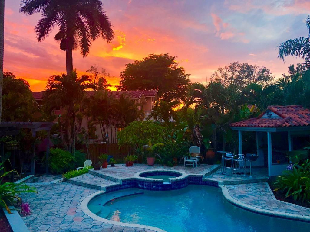 Nestled on a sprawling 1.25-acre lakefront lot in the prestigious, no-HOA equestrian heart of Davie, this magnificent 4-bedroom, 5-bathroom estate offers 3,923 sq. ft. of uncompromised luxury and privacy. Step inside to an open-concept layout flooded with natural light, featuring stunning marble flooring, a cozy fireplace, and a gourmet kitchen complete with granite countertops and stainless steel appliances. The massive 1,200 sq. ft. primary suite is a true sanctuary, boasting a private office, extensive closet space, a jacuzzi, a sauna, and direct access to a balcony overlooking serene water views. The upper level features 3 comfortable bedrooms, 2 full baths, a maid's room, and a spacious playroom/studio equipped with a separate entrance—offering endless potential for a home business. Nestled on a sprawling 1.25-acre lakefront lot in the prestigious, no-HOA equestrian heart of Davie, this magnificent 4-bedroom, 5-bathroom estate offers 3,923 sq. ft. of uncompromised luxury and privacy. Step inside to an open-concept layout flooded with natural light, featuring stunning marble flooring, a cozy fireplace, and a gourmet kitchen complete with granite countertops and stainless steel appliances. The massive 1,200 sq. ft. primary suite is a true sanctuary, boasting a private office, extensive closet space, a jacuzzi, a sauna, and direct access to a balcony overlooking serene water views. The upper level features 3 comfortable bedrooms, 2 full baths, a maid's room, and a spacious playroom/studio equipped with a separate entrance—offering endless potential for a home business, private gym, or guest suite. Outside, live the ultimate South Florida lifestyle with a private pool, spa, pool bar, and 150 feet of premium water frontage surrounded by lush tropical landscaping. Complete with a 4-car garage configuration and an expansive circular driveway. Capitalize on this rare, unrestricted property today!
