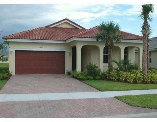 3 bed, 2 baths, 2 cars garage, this home in popular Newport Isles gated community is mites away from Tradition and 1-95 freeway. Unit is freshly painted ,tile floor in the kitchen and living room. Luxury waterproof vinyl plank flooring in the bedrooms .Kitchen has upgraded stainless steel appliances. Master bedroom with walk in closet . pavers patio covered with a panoramic view of the lake b av window in kitchen and new washer and dryer . Newport Isles host an array of amenities for the residents this includes clubhouse, 2 pools for adults , 2 tennis courts, a basketball court,   THIS HOME IS AL MUST SEE. SELLER MOTIVATED MAKE YOUR OFFER. EXCELLENT FINNCING OPTION,  SELLER WILLING TO PAY CLOSING COSTS Driving Directions: 1-95 to Exit 118 Gatlin Blvd., East to Brigantine Pl., Right to community Newport Isles entranceway, just b