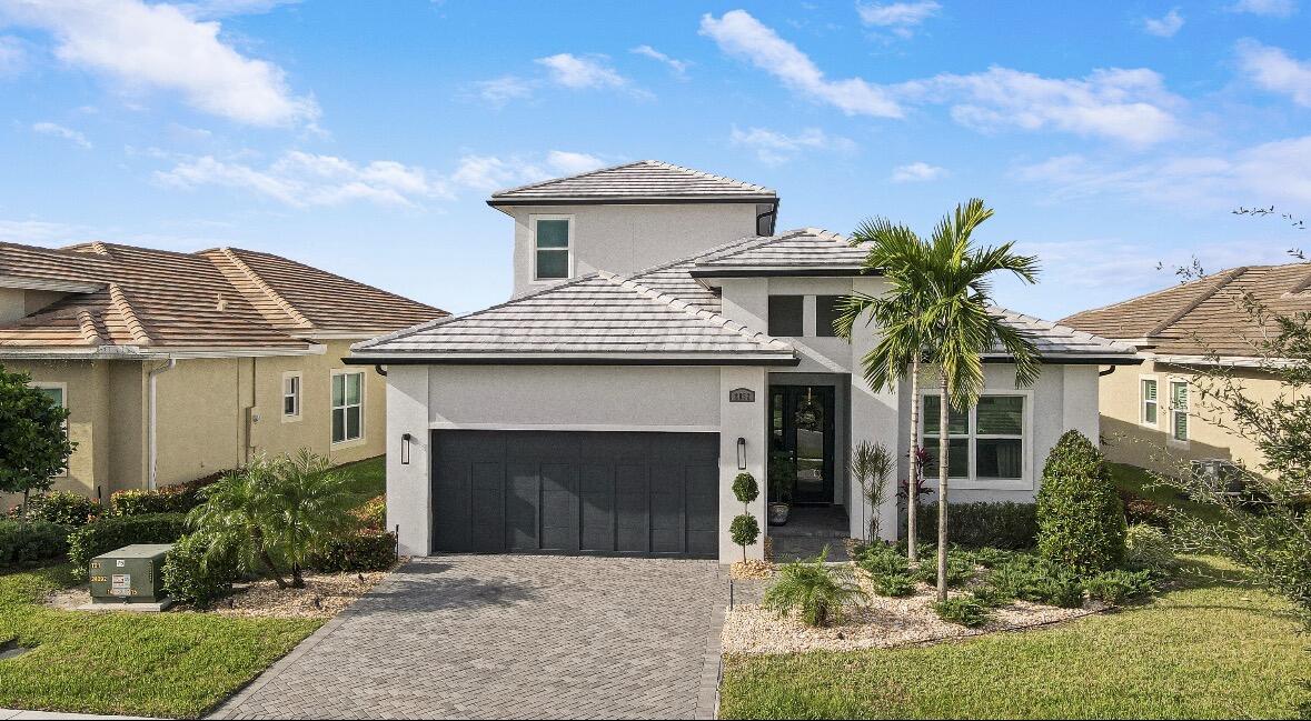 EVER POPULAR LAGO PLAN W/ LOFT ON A LAKEFRONT LOT WITH THE ADDED BONUS OF A FULL SUITE AND LIVING AREA UPSTAIRS!! This 3BR+Den+Loft/3BA/2CG home built in 2021 has been well maintained and beautifully upgraded & is ready for its new owners. GORGEOUS NEW POOL & SPA BUILT IN 2024! Wood look tile flooring flows through the main living areas and den and you'll appreciate the custom built in units and upgraded lighting t/o. The open great room is the heart of the home w/ a large kitchen featuring gray cabinetry, tiled backsplash, quartz counters, oversized island, pendant lighting, stainless steel appliances, hood vent, wall oven, apron front sink, walk-in pantry and breakfast bar seating.  The living area has a built in TV unit, tray ceiling, fan, PLUS access out to your own OUTDOOR OASIS complete with pavered patio, salt-water pool, spa and screened patio! The master suite is a tranquil retreat with views of the lake and spa-like ensuite. The den/office with wall-to-wall built in desk unit and glass french doors is perfect as a home office and offers an abundance of storage. A second bedroom and full bathroom is located downstairs as well as the laundry room. Upstairs you will find a full living area, bedroom and bathroom - perfect for guests to enjoy their own private space. The screened and covered patio plus recently added extended travertine open patio overlook the lake and provide a relaxing outdoor space! Splash through the summers while relaxing in the pool, hot tub or lounging on the splash deck. Fenced back yard is great for those furry family members. Other special features include impact glass windows and doors throughout, neutral interior paint scheme and beautiful detail throughout. Verano is an amenity rich community with a 27-court pickleball center, walking paths, multiple community pools & fitness centers, sauna, dog park, tennis courts, social clubhouse with activities and much more. HOA dues include basic cable, internet, alarm monitoring, lawn care, common area maintenance, gated security and access to all amenities. For avid golfers, there is a cart path from the community leading to the PGA Golf Club (membership is optional and availability varies). This community truly has something for everyone. Call today for your appointment to view this special property!