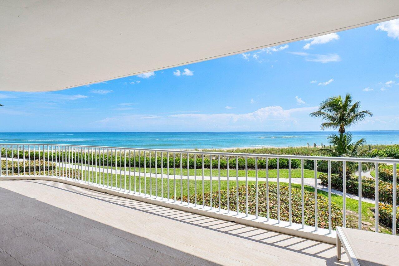 Beautifully renovated 2nd floor condo offers a tranquil oceanfront retreat. Impeccable design choices include wood-look ceramic flooring, luxurious White Isis Marble, shimmering Mercury Glass kitchen accents, & a lavish Master Bath showcasing Capiz shell, marble, and Mother of Pearl. Floor-to-ceiling windows in the open-concept living space, Master Suite, and Guest Suite frame breathtaking southeast ocean views. A gracefully curved, covered balcony, accessible from every room, invites relaxation & alfresco dining. The expansive living area is ideal for effortless entertaining. The gourmet kitchen, complete w/ a beautiful island, provides ample storage & a casual dining space. Sailfish Point offers the ultimate Florida resort lifestyle with its oceanfront country club, fine & casual dining, Sailfish Point offers the ultimate Florida resort lifestyle with its oceanfront country club, fine & casual dining, Har-Tru tennis courts, Jack Nicklaus "Signature" golf course, state-of-the-art fitness center & spa, helipad, 1.5 miles of gorgeous beach, and 24/7 guarded & patrolled security for peace of mind.