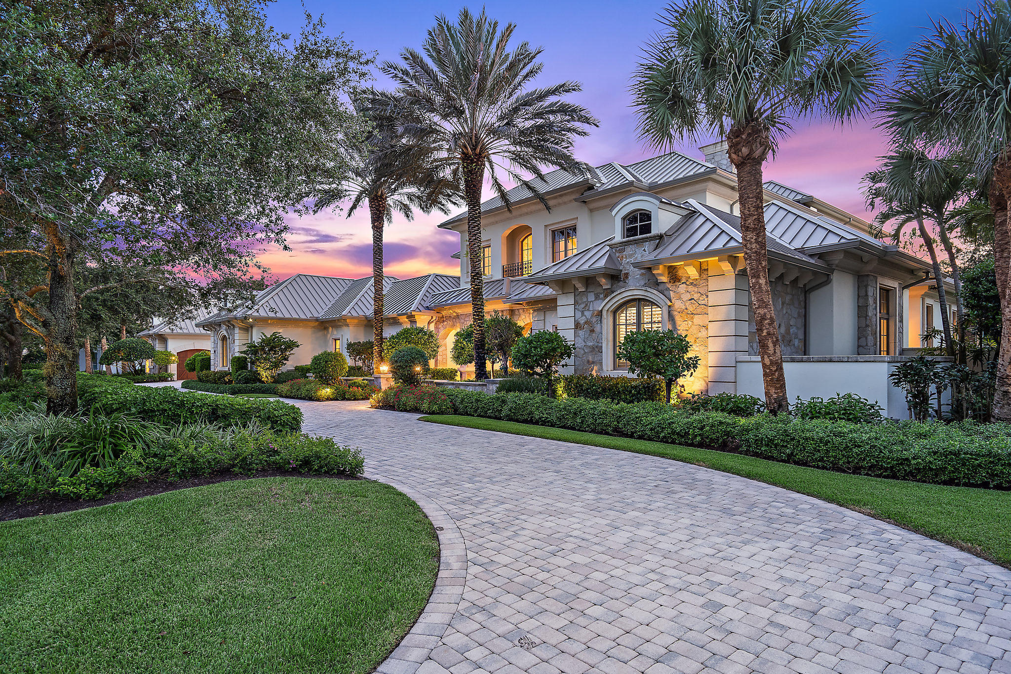 13161 Sabal Chase in Palm Beach Gardens is truly one of the most elegant homes in one of the most prestigious neighborhoods in the Palm Beaches.  Situated on a beautifully landscaped and serene one-acre lot, this stately 5-bedroom, 5.2 bath home has much to offer – 6,832 sq. ft. of air-conditioned space, 12,371 sq. ft. under roof and two air-conditioned two-car garages.  Attention to finishing details can be seen throughout in the fieldstone and cast stone exterior and the imported French limestone and hardwood flooring, rich built-in wood cabinetry and crown moldings, carved wood tray and box beam ceilings, marble backsplashes, granite countertops, sophisticated lighting fixtures, designer wallpapers and wainscoting in the interior. The elegant two-story foyer opens to a Great Room featuring a disappearing window wall of glass leading to a screened porch extending across the entire length of the house that, with its inviting gas fireplace and cozy seating areas, offers unparalleled views of the Old Marsh nature preserve.  The formal entry hall to the very private first floor Master Bedroom Suite overlooks a manicured courtyard, while the Master Bath surrounds you in glass and mirrors and offers a separate tub and shower as well as his and hers vanities with decorator sinks, hardware and lighting.  An oversized walk-in closet and a second washer and dryer are two more examples of the many conveniences this home offers.  Each of the four Guest Bedrooms boasts custom designer treatments and its own adjoining bath.  The gourmet Kitchen features Wolf, Subzero and Miele appliances, two islands for plenty of workspace and a Butler's Pantry that allows for ease of serving to both the separate formal Dining Room and the adjoining Breakfast Room.  The richly wood paneled Den/Office serves as a multipurpose getaway for working at home, watching TV, reading or quiet conversation.  An expansive covered Lanai with a Summer Kitchen and several separate seating areas surrounds the resort-style Pool and Spa Deck and creates an abundance of space to entertain or simply relax.  The second-floor Billiard/Game Room and two of the Guest Bedrooms open to an expansive covered Balcony and the rear stairs lead to a 174 sq. ft. finished and air-conditioned Storage Room.  Impact glass throughout and a whole-house generator protects from inclement weather.
 
And then, of course, there is Old Marsh itself, a small and exclusive, gated community, tucked away and intimate, surrounded on three sides by hundreds of acres of beautiful nature preserves that will never be developed. Old Marsh contains only custom estate homes on half-acre or larger lots, with marsh, lake or golf course views. The 18-hole championship golf course was designed by the highly renowned architect Pete Dye and consistently has been ranked one of the best in the United States. No starting times and a nationally acclaimed caddy program enrich your experience on the course. Old Marsh Golf Club, with its recently enlarged clubhouse, its warm and friendly atmosphere and its service oriented staff, has been recognized as one of the top 35 private clubs in the country and Audubon International has awarded it certification for its environmentally enhancing design. 
 
It's not hard to picture yourself living here  in a house that is warm and elegant, in a gated community that is friendly and secure.  A tranquil and relaxing place you would be proud to call home, yet one that is still just minutes from the airport, the ocean, fine public and private schools and all of the shopping, dining, cultural and entertainment venues that the Palm Beaches offer.