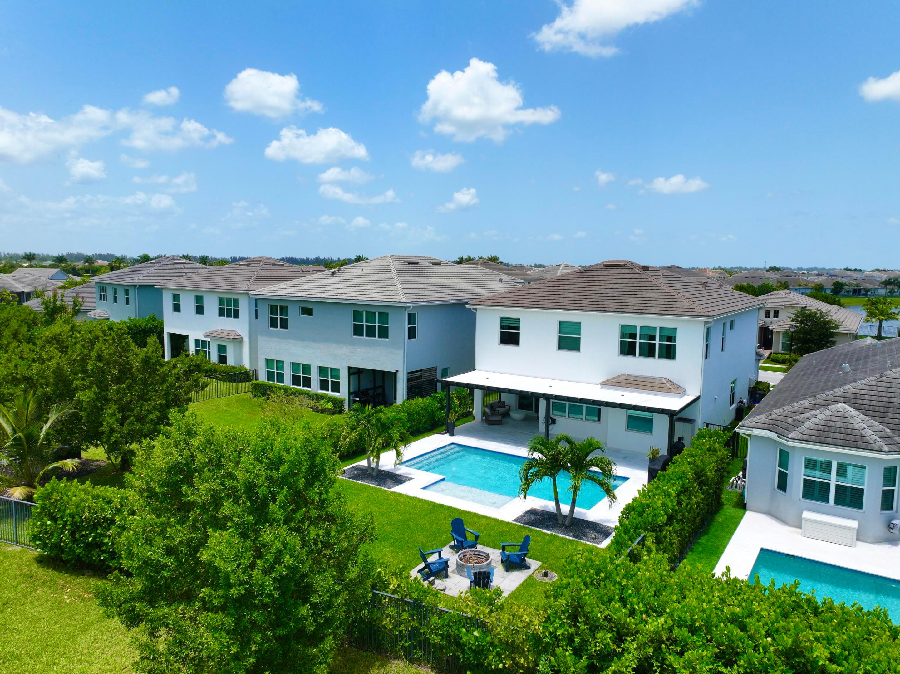 4631 Canopy Grove Drive, Westlake, FL 33470 *** 2021 Poinciana Model,  over 3800 total sq ft  , complete impact glass **  Resort style living *** Priced Right ***. Best priced home in Amazing  Westlake  Florida WITH HIGH END FINISHES  AND MULTI UPGRADES  *** MAJOR $50,000 IMPROVEMENT- NOW OFFERED AT $825,000 !!!  MOTIVATED SELLERS AND AN EXCEPTIONAL OPPORTUNITY IN DESIRABLE WESTLAKE !!  Why wait to build when you can enjoy this spacious 4-bedroom, 3.5-bathroom , split 3 car attached  garage with NEW epoxy flooring    plus newly added private heated saltwater  pool !!! home with Den/ possibility of 5th bedroom on 1st floor  and loft on second Floor/ play area / exercise area/ office area **.  Gourmet kitchen double wall oven, large island with quartz countertops ,white shaker cabinetry, stainless appliances and extended cabinetry - ideal for coffee or beverage bar**  Step outside to your private Florida  retreat featuring  covered lanai with new extended patio  roof, marble pool deck  spacious backyard with exterior fire pit and upgraded beautiful  landscaping with lighting  -- "over $125,000 in improvements  per seller" .With over 3800 total  square ft - This home is designed for comfortable  Florida living and entertaining, This impressive home features generous living areas, a private pool, and plenty of room for guests. Located in desirable Groves of Westlake community, residents enjoy access to Westlake's exceptional amenities and lifestyle.   Ceramic window tint - energy efficient  **. custom built wall entertainment with fire place  and  ambience lighting  !!  Why wait to build ??? 4631 Canopy Grove Drive, Westlake, FL 33470 *** over 3800 total sq ft **  !!  At this newly reduced price, this home represents an outstanding opportunity for buyers looking for space, a private pool and value in one of the areas's most sort -after communities.  SCHEDULE YOUR PRIVATE SHOWING TODAY FOR  4631 Canopy Grove Drive, Westlake, FL 33470 AND BRING YOUR OFFER  now
