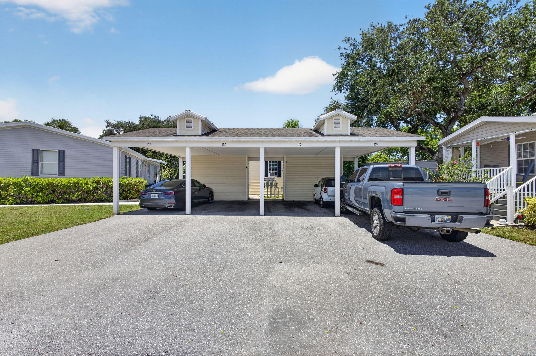 Welcome to this beautifully updated home in a prime Palm Beach Gardens location! This elegant 3/2 residence has been thoughtfully renovated throughout, featuring a newer kitchen, updated bathrooms, new flooring, and stylish modern finishes. The open-concept floor plan is perfect for entertaining and everyday living, highlighted by gorgeous porcelain tile flooring in the main living areas and rich real wood flooring in the bedrooms. The stunning white kitchen features self-closing cabinetry, sleek gold hardware, and ample storage and workspace.Situated on a large waterfront lot with tropical landscaping, this home offers both beauty and functionality. Residents enjoy a low-maintenance lifestyle, as the monthly LAND LEASE includes lot rent, lawn care, cable,city water, sewer, trash service!