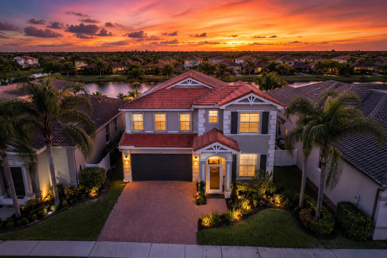 Walk out of this home at six in the morning and you will understand. Quite sidewalks, paver drives, golf carts headed for coffee, fountains going on the lakes. You are close to everything but it does not feel like it. This is the Melrose, the only floor plan in Palm Beach Plantation with 5 bedrooms and 3 full baths on a 2 car garage. 2,762 SF. Many buyers look for one bedroom and full bath downstairs with a separate living room beside it. Family room off the kitchen. Twin AC systems. Partial impact glass with accordion shutters. Out back, a oversized covered screened patio faces the lake and two fountains. Built for easy entertianing.  Gated with resort pool and spa, clubhouse, fitness center, tennis,pickleball court & playground. Everglades Elementary outside the gate. WHAT IT IS REALLY LIKE LIVING IN PALM BEACH PLANTATION Palm Beach Plantation is the kind of neighborhood that reveals itself slowly. Early in the morning, before Southern Boulevard gets busy and the rest of Palm Beach County starts moving, the neighborhood belongs to walkers, dogs and golf carts. Residents follow the concrete sidewalks toward the Palm Beach Canal, passing still lakes, mature palms and homes set behind paver driveways. Someone is heading out for coffee. Someone else is getting in a morning walk. Sprinklers are running. Fountains are moving across the lakes. Behind the gates, the day starts a little quieter. That is the part a map cannot show you. Palm Beach Plantation carries a West Palm Beach address, but everyday life connects naturally to Wellington and Royal Palm Beach. You are close to what you need without feeling like you live in the middle of everything. The community is gated, established and lined with sidewalks. The landscaping has had time to mature, and lakes create pockets of open space throughout the neighborhood. At this home, that sense of space continues out back. The large covered and screened patio overlooks the lake and two fountains. In the morning, it is a place for coffee before the house wakes up. In the afternoon, the roof and screen provide shade from the South Florida sun. In the evening, the fountains catch the fading light and the patio becomes an outdoor living room. Add a dining table, comfortable seating, a television and the grill. This is not a patio you occasionally step onto. It is a space you can actually live in. On certain quiet nights, depending on the weather and wind direction, music from iTHINK Financial Amphitheatre may carry into the backyard. You are not sitting in the front row, but you may recognize the concert playing that night. Some people will think that is one of the coolest parts of living here. Others may not. Either way, it is the kind of local detail most listing descriptions would never tell you. A FLOOR PLAN THAT WORKS IN REAL LIFE Inside, the home offers five bedrooms, three full bathrooms, a two car garage and more than twenty seven hundred square feet under air. The numbers matter, but the layout matters more. One bedroom and a full bathroom are downstairs. That room can change as life changes. It can accommodate overnight guests, provide space for multigenerational living, become a private office or serve anyone who would prefer not to use the stairs. Separate living, dining and family rooms give the house breathing room. Dinner can be happening in one space while a movie is playing in another. Someone can work from home without taking over the main living area. The house does not force every part of daily life into one oversized room. Upstairs, the primary suite is joined by three additional bedrooms. Two separate air conditioning systems allow the first and second floors to be managed independently. The home has partial impact glass, with accordion shutters protecting the remaining designated openings. The prior listing reports updated air conditioning equipment and a newer water heater. Buyers should independently verify the condition, age and permitting of all improvements. LIFE BEYOND THE FRONT GATE As the morning gets moving, the convenience of this location begins to show. Dunkin' is close enough for a quick golf cart coffee run where permitted. Costco is nearby, and locals know its gas station routinely has some of the lowest prices in Palm Beach County. Don Ramon Cuban Cuisine sits in the same Southern Boulevard shopping area and has long been a local stop for Cuban coffee, ropa vieja, lechón and a proper Cuban sandwich. Everglades Elementary School is located immediately outside Palm Beach Plantation. It is close enough that some residents make the school run by golf cart, subject to permitted routes, traffic laws and school procedures. When it is time to get outside, Okeeheelee Park is just down the road. You can walk the trails, play golf, visit the equestrian facilities or spend time around the lakes. Shark Wake Park adds cable wakeboarding, kneeboarding, a floating obstacle course and a ropes course. The Mall at Wellington Green, Trader Joe's, Whole Foods Market, Sprouts, Publix, Target, Lowe's and Home Depot are all within the surrounding Wellington, Royal Palm Beach and Southern Boulevard corridors. Nearby dining options include Don Ramon, Kaluz Wellington, Agliolio, Stonewood Grill and Tavern, Bonefish Grill, Ford's Garage, Cooper's Hawk Winery and Restaurant and Oli's Fashion Cuisine. For concerts and community events, iTHINK Financial Amphitheatre and the South Florida Fairgrounds are nearby. Wellington International and the National Polo Center connect the area to Wellington's equestrian season. When you need to go farther, Southern Boulevard provides a direct route to the Florida Turnpike, Interstate Ninety Five, Palm Beach International Airport, Downtown West Palm Beach, CityPlace, Clematis Street, Brightline and the coast. PALM BEACH PLANTATION AMENITIES Palm Beach Plantation, also identified as Diamond C Ranch in public records, is a gated community of approximately six hundred single family homes spread across roughly two hundred sixty one acres. Community amenities include a resort style swimming pool and spa, clubhouse, fitness center, tennis courts, basketball court, sports courts, playground, picnic areas, concrete sidewalks, walking paths, landscaped common areas and gated entry. The amenities are substantial, but they are not the whole story. The real appeal is how naturally they fit into everyday life. You can exercise without leaving the neighborhood, spend an afternoon at the pool, take an evening walk or give visiting guests something to do without maintaining all of it in your own backyard. A COMBINATION THAT IS DIFFICULT TO REPLACE Five bedroom homes are available. Lakefront homes are available. Homes with a downstairs bedroom are available. Finding all of those features together is where the search gets thin. A current Palm Beach County MLS search under six hundred seventy five thousand dollars found only one other active property offering five bedrooms, three full bathrooms, more than twenty seven hundred square feet, at least a two car garage and a waterfront setting. This home adds a first floor bedroom and full bathroom, an oversized covered and screened lakefront patio, views of two fountains and the full amenity package of gated Palm Beach Plantation. Inventory can change at any time. The point is not that another home will never come along. The point is that buyers who need this particular combination have very few substitutes available today. WHAT MAKES THIS HOME DIFFERENT The real value here is not one feature by itself. It is the way everything comes together. Five bedrooms provide room to adapt. The downstairs bedroom and full bathroom solve a problem many two story homes do not. The lake creates privacy and an open view. The screened patio gives you a place to enjoy that view throughout the year. Outside the home, Palm Beach Plantation provides the pool, clubhouse, fitness center, sports courts and sidewalks without requiring you to maintain them yourself