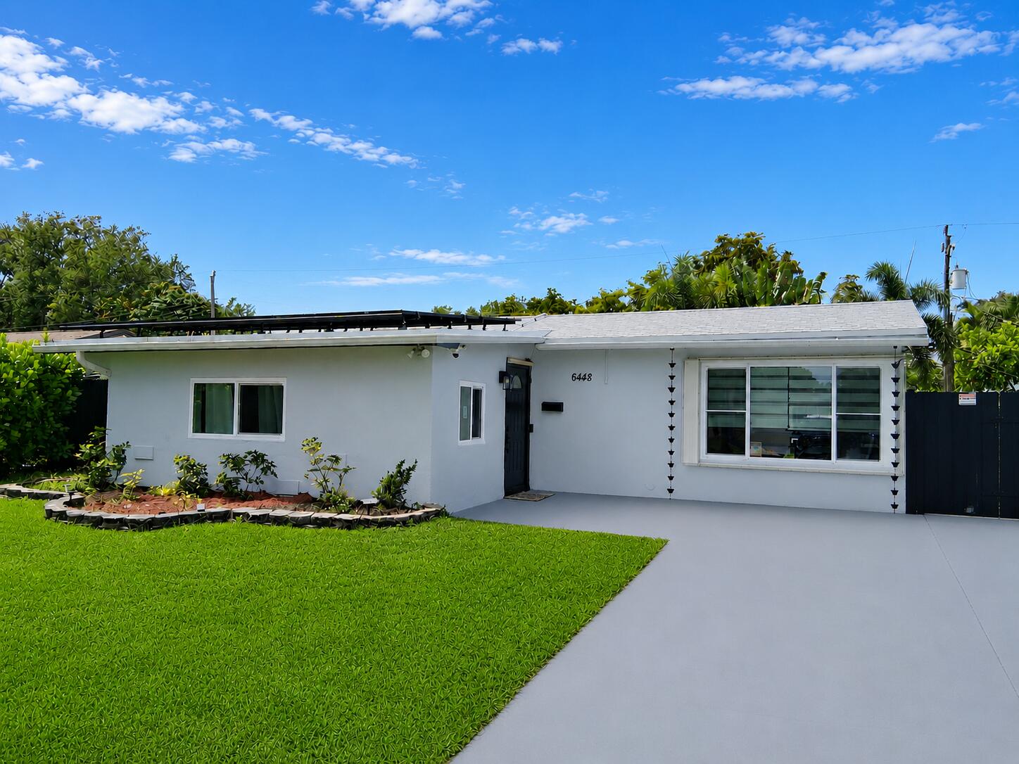 Enjoy gentle breezes while relaxing by your pool in this updated home on a quiet dead-end street*Roof 2023*Solar panels 2023 provide lower light bills*Impact-resistant windows & sliding doors thru-out*18x18 tile flooring, 3 bedrooms & 2 updated bathrooms, plus additional room ideal for a 4th bedroom*Spacious living dining area*eat-in kitchen featuring custom wood cabinetry with frosted glass, granite countertops, flat-top stove, side-by-side fridge, under-cabinet lighting, extra countertop workspace with mini fridge, & additional pantry space*Primary bathroom features updated vanity with wood medicine cabinet. Both bathrooms have tiled walls & updated finishes. Outdoor features include Mexican tile on the pool patio*attractive brick pool coping*shade sail over the pool* Large spacious back yard with 2 sheds one substantially large*larger shed has electric*Tankless water heater*Pool equipment included. Rebel Pool cleaner*The Sprinkler, many lights, the pool pump, and 1 fan are Wi-Fi controlled. (Owner to pay off the solar panels at closing)