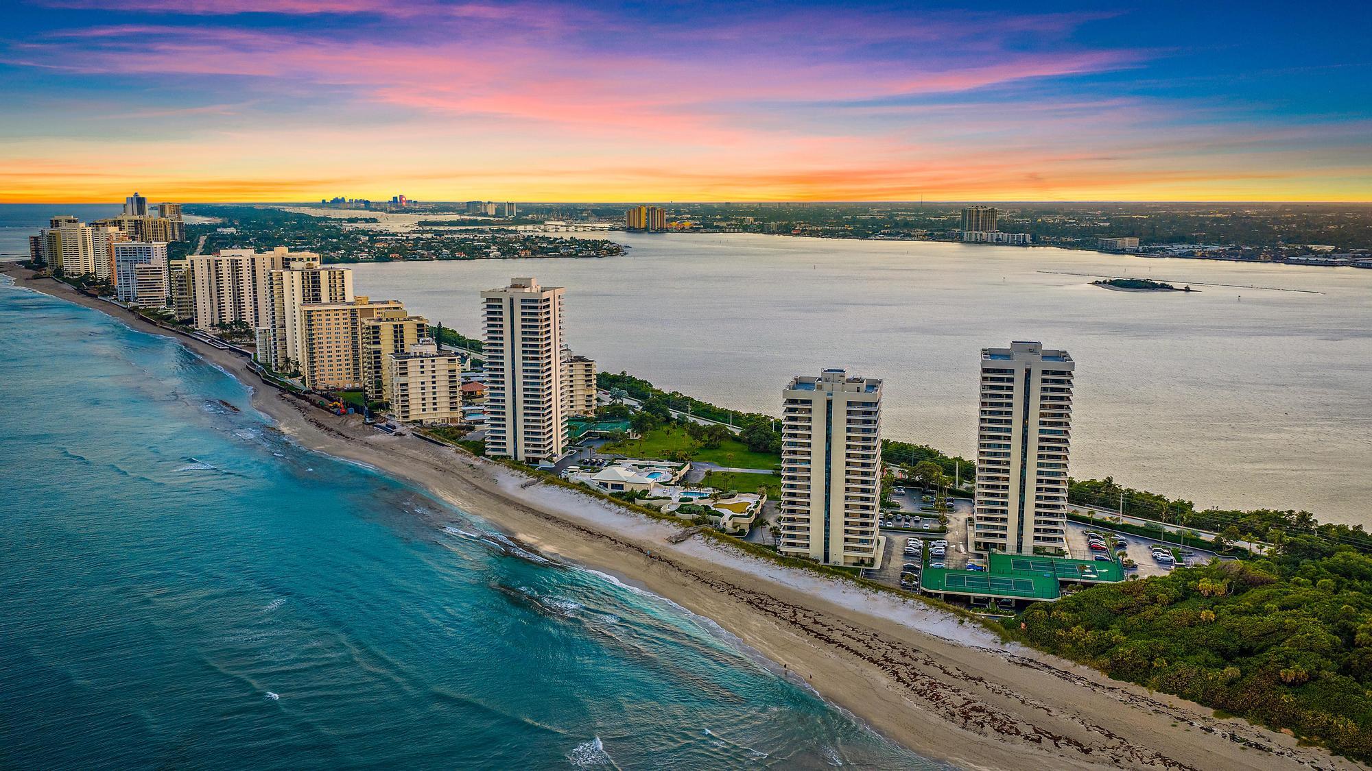 Wake up to sunrise views and unwind each evening with sunsets over the Intracoastal in this front-row coastal residence. Located in the gated, oceanfront community of Water Glades on Singer Island, this beautifully renovated condo offers sweeping views of the ocean, Intracoastal, and city skyline. Spanning over 1,400 square feet, the residence features two bedrooms and two full bathrooms with a bright, open layout and tile flooring throughout. Expansive sliding glass doors fill the space with natural light and frame stunning water views. The condo is curated with some furnishings negotiable (minus exceptions) for an easy move-in experience. Impact-rated windows throughout the residence provide both security and peace of mind, complemented by thoughtful upgrades including a new bidet, advanced water filtration with hot and cold systems, and newer appliances.

The renovated kitchen includes white cabinetry, quartz countertops, stainless steel appliances, a wine cooler, newer hot water on demand at the kitchen sink, and a large island that opens to the living areaperfect for everyday living and entertaining. Step onto the covered balcony to enjoy ocean breezes, passing boats, and vibrant sunsets.

The primary suite offers a peaceful retreat with a sitting area, spacious closet, and spa-style bathroom with dual vanities, glass-enclosed shower, and soaking tub. The guest suite is equally inviting and generously sized, easily accommodating family and guests.

Water Glades is a premier, 24-hour manned-gated oceanfront community offering a refined, low-maintenance lifestyle. Residents enjoy a newly renovated lobby, two resort-style pools, a fitness center, putting green, tennis courts, shuffleboard, a well-appointed library and community rooms, and one parking space. Nestled alongside a preserve, the property offers a sense of privacy and tranquility rarely found on Singer Island. Ideally situated just minutes from world-class waterfront dining, upscale shopping, and entertainment, with convenient access to PGA Boulevard, this residence places the very best of coastal South Florida living within reach. Endless outdoor pursuitsfrom boating and fishing to golfare right at your fingertips. The building has successfully completed its 30-year recertification, including new balconies and structural repairs, with spalling completed and painting scheduled by the association. All current assessments have been paid in full, with no known pending assessments, providing confidence and long-term value for the next owner.