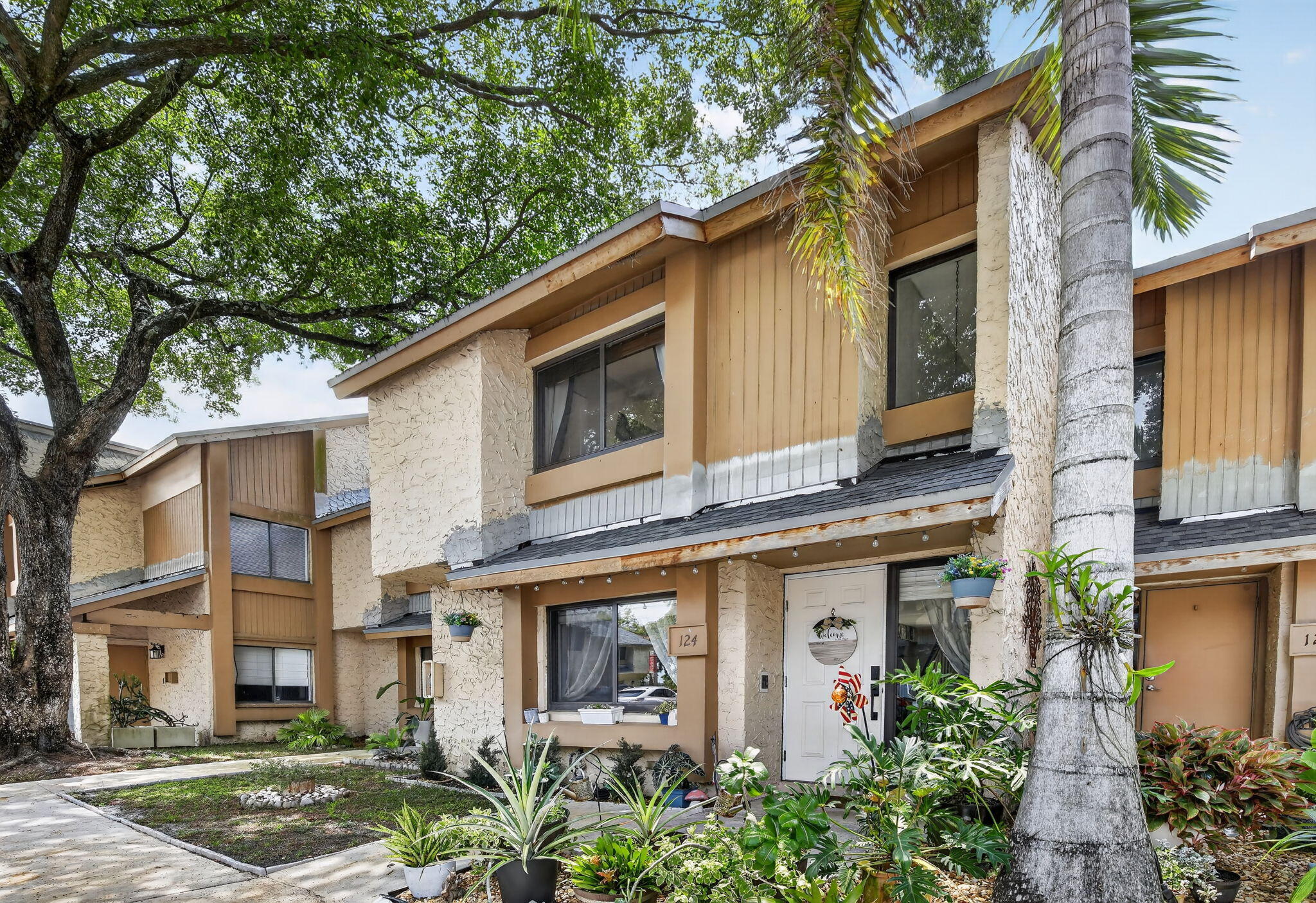 Completely renovated 2-bedroom, 2.5-bath in sought-after Wimbledon at Jacaranda. This two-story home features an updated kitchen with modern cabinetry, tile backsplash, SS appliances, renovated baths, and wood-look tile flooring throughout. Major improvements include impact windows (2024), new roof (2024), new ductwork (2023), washer/dryer (2023), electric panel (2021), and water heater (2025). Enjoy a private courtyard patio ideal for outdoor living and entertaining. Furniture negotiable. Special assessment paid in full. HOA improvements underway include new soffits, PVC courtyard fencing, exterior stucco, and fresh exterior paint. Community amenities include a pool, clubhouse, and tennis courts, complemented by a prime Plantation location near shopping, dining, parks, and major roadways.