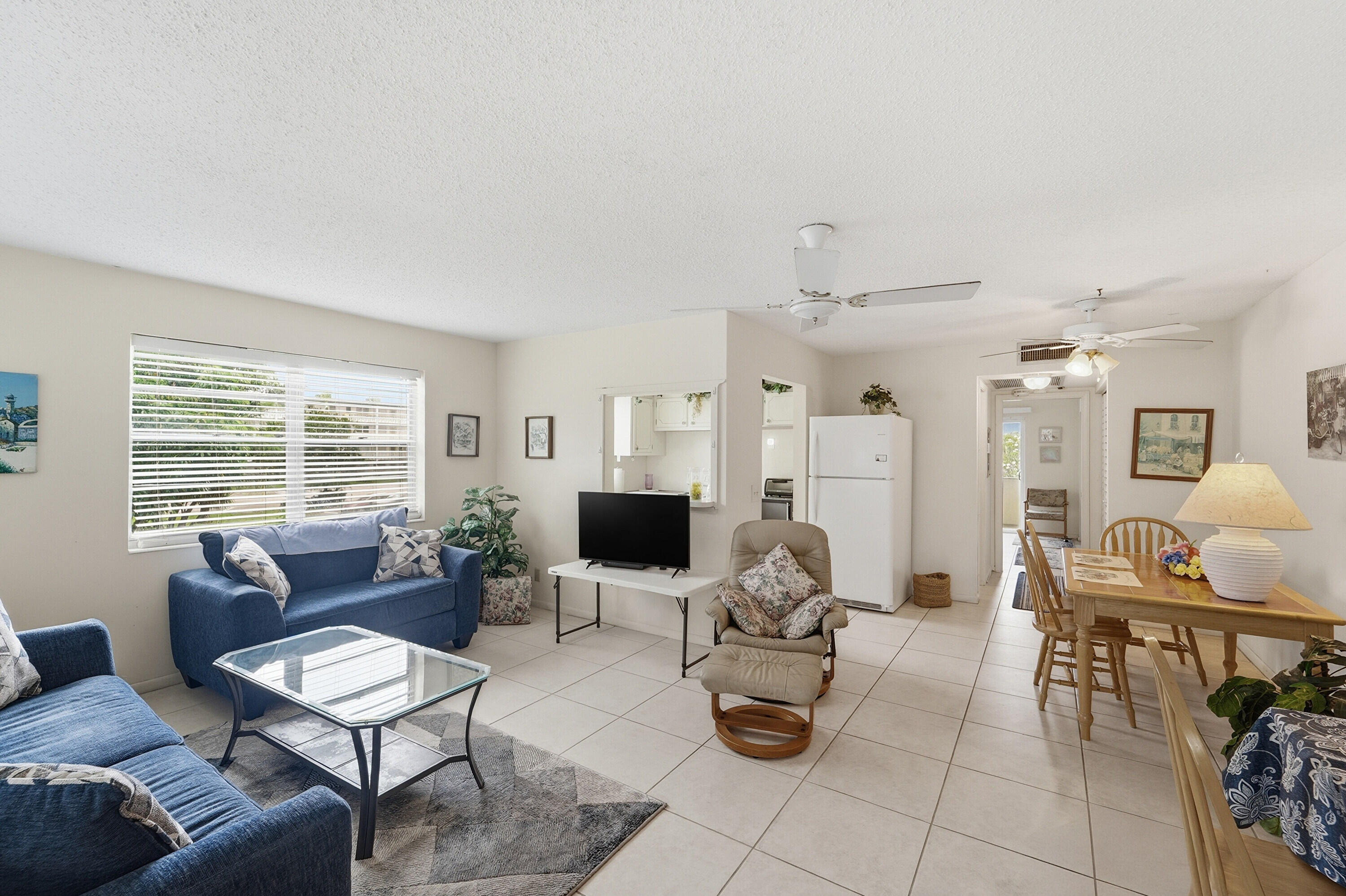 Come in and make this spacious 1BR/1.1BA unit your own. Ideally located just steps from the elevator, this home features a screened-in lanai—perfect for relaxing. Offered fully furnished, it includes a new couch, matching loveseat, new cocktail table, & 2 new TVs. Additional updates include a new refrigerator, A/C (2024), electrical panel (2024), & all new closet doors. Enjoy the convenience of laundry & storage on the same floor, with a pool located just across the street. Monthly maintenance includes cable & WIFI. Community features 3 associations: Condo Ass.$350/month, Cen Club $120/month) & Master Ass. $185/month Located in a desirable 55+ community offering resort-style living with a state-of-the-art clubhouse, fitness center, café, dance classes, and endless entertainment options.